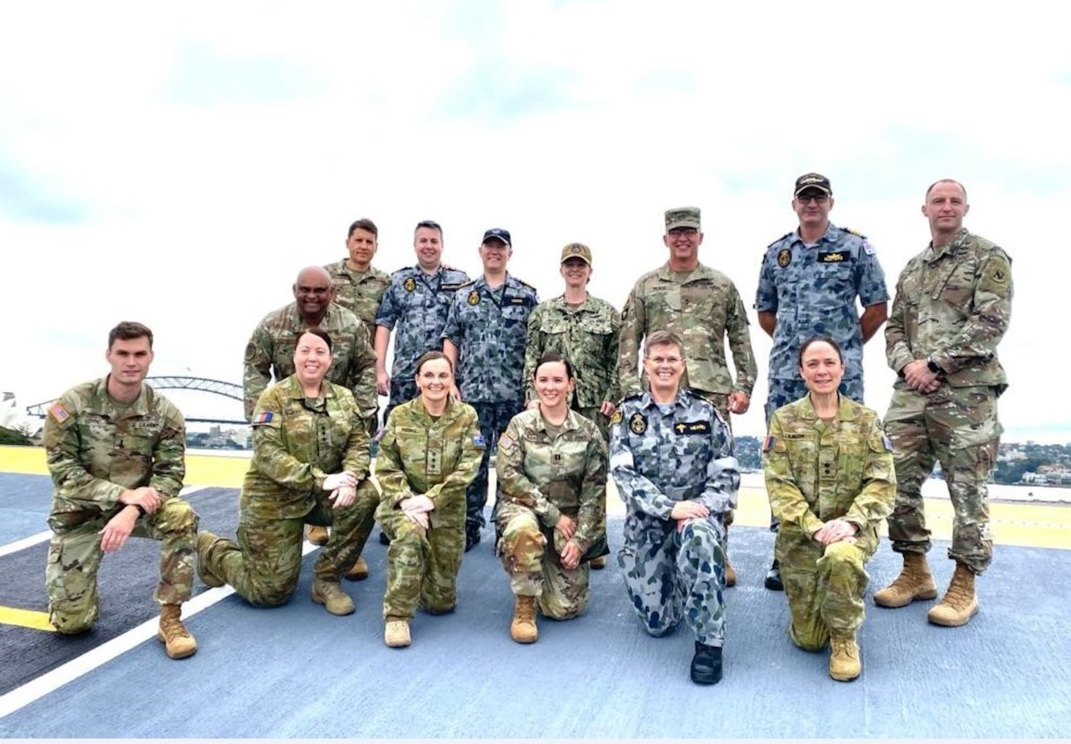 SYDNEY, Australia – Members of the U.S. Medical Delegation and Royal Australian Navy pose for a picture on the deck of the HMAS Adelaide April 26, 2022, Sydney, Australia. This was part of an April 25 to May 4, 2022, U.S. health delegation visit to enhance Australian-U.S. health interoperability.