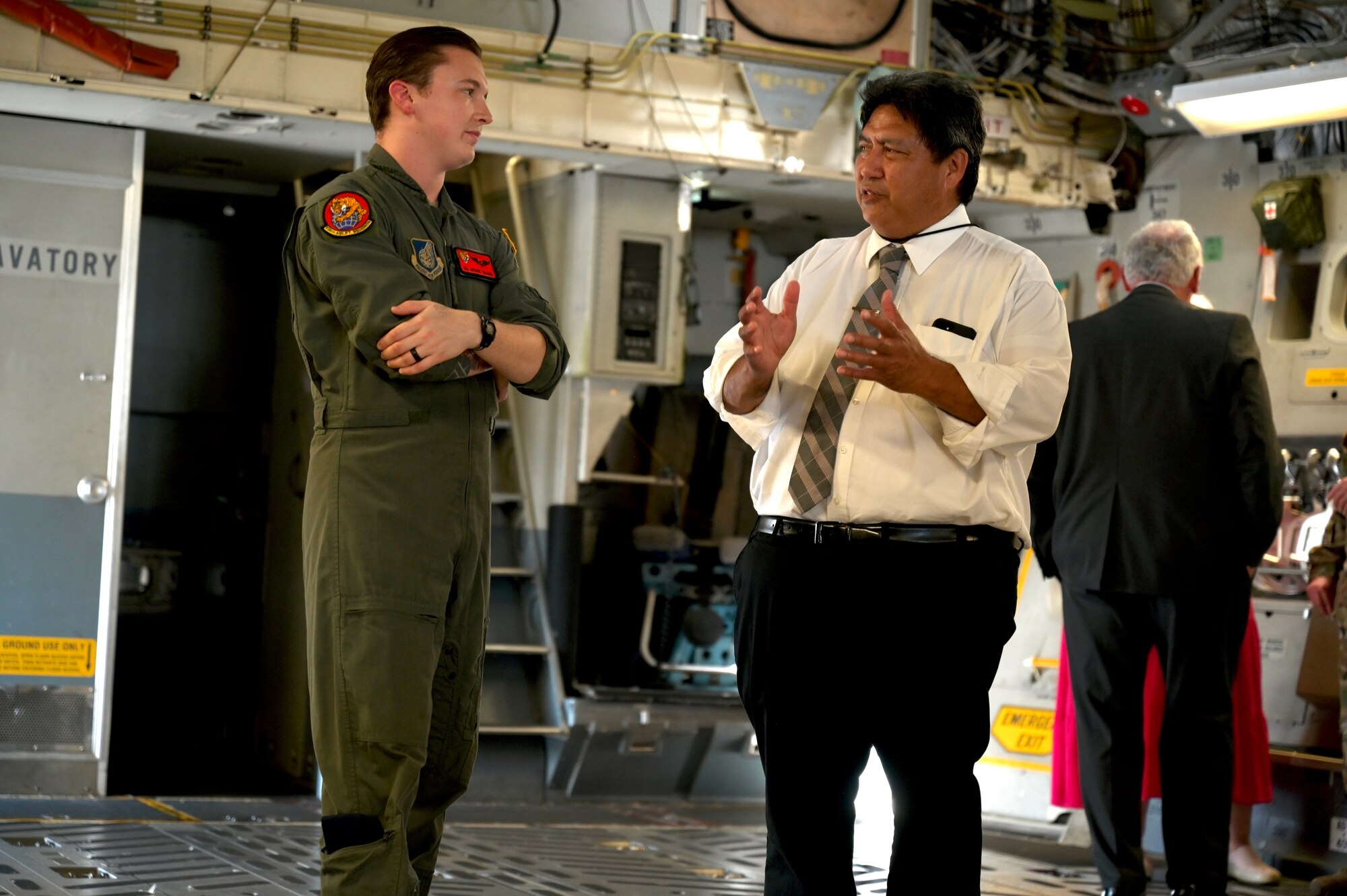 Senior Airman Anthony Wagnon, 535th Airlift Squadron loadmaster, talks with Vonn Logan, The Church of Jesus Christ of Latter-day Saints welfare self-reliance manager, about C-17 Globemaster III capabilities during a Cultural Religious Leader Engagement event at Joint Base Pearl Harbor-Hickam, Hawaii, May 12, 2022. As part of strengthening Airmen’s spiritual resilience as well as building community relations, the 647th Air Base Group chaplain corps invited local religious leaders to JBPHH to discuss their organizations, their missions, and learn about the Air Force’s focus on spiritual resiliency. (U.S. Air Force photo by 1st Lt. Benjamin Aronson)