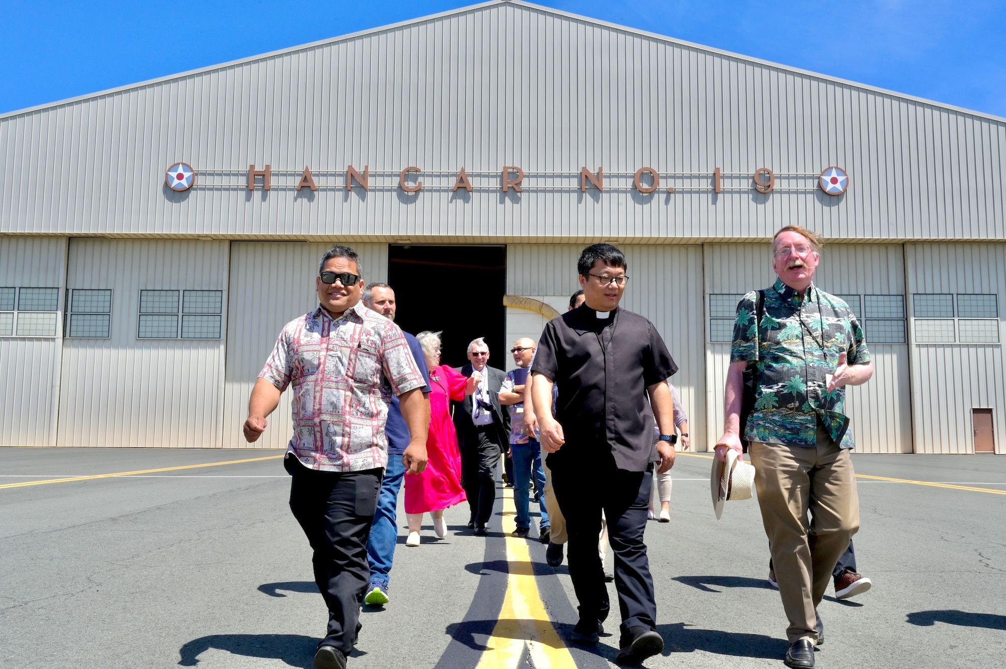 Local religious leaders walk out to a C-17 Globemaster III static display as part of a Cultural Religious Leader Engagement event at Joint Base Pearl Harbor-Hickam, Hawaii, May 12, 2022. As part of strengthening Airmen’s spiritual resilience as well as building community relations, the 647th Air Base Group chaplain corps invited local religious leaders to JBPHH to discuss their organizations, their missions, and learn about the Air Force’s focus on  spiritual resiliency. (U.S. Air Force photo by 1st Lt. Benjamin Aronson)