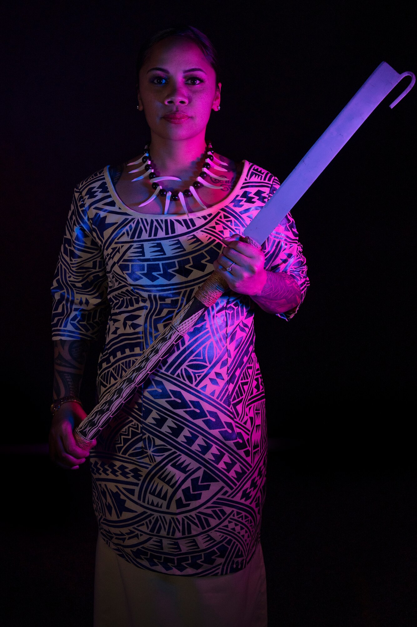 Samoan woman holding a Samoan knife