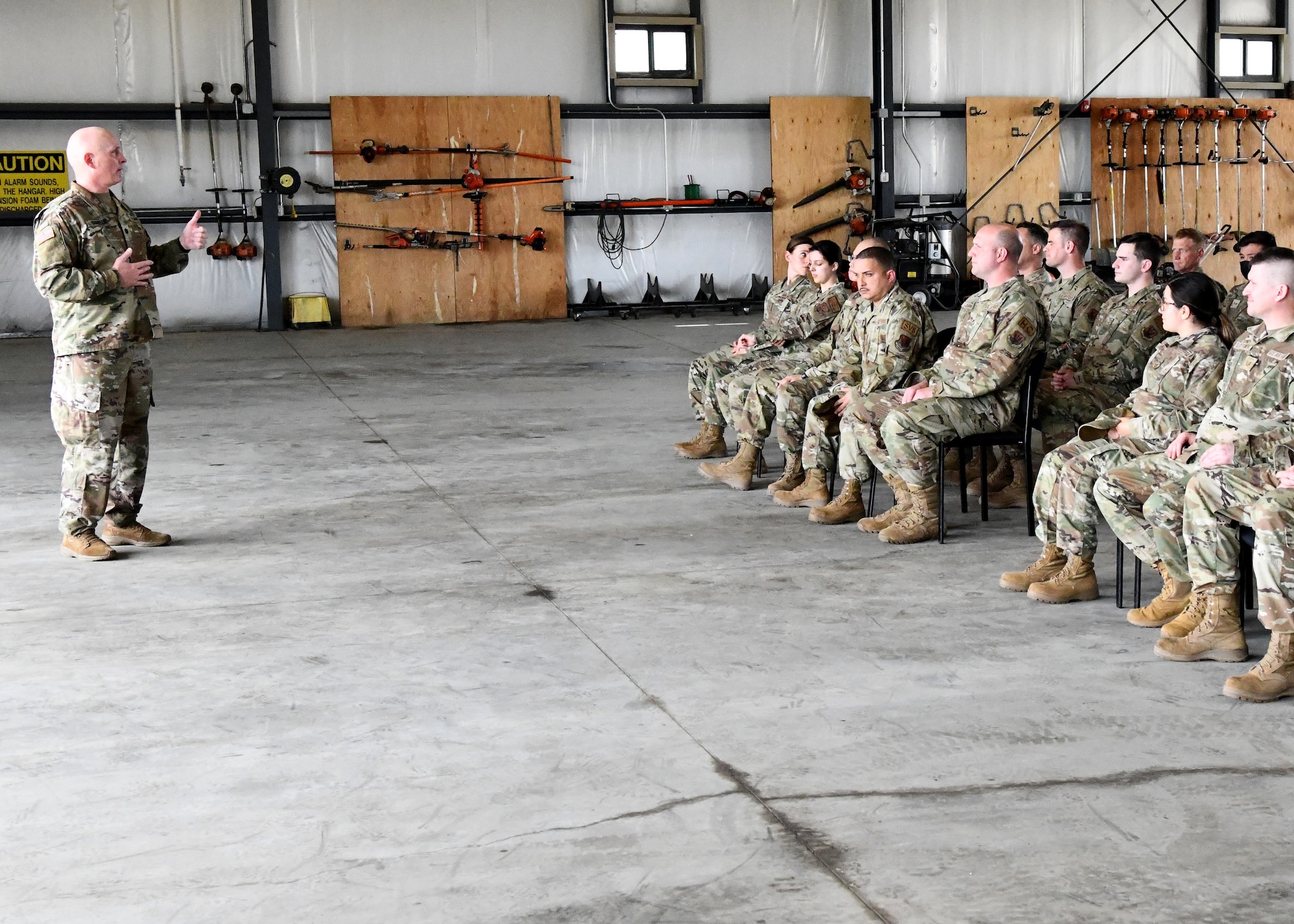 U.S. Army Lt. Col. Patrick Donnelly, Task Force Powderhorn senior leader, addresses Airmen during the TF Powderhorn awards ceremony at Barnes Air National Guard Base, Massachusetts, May 14, 2022. Fifty four Barnestormers were awarded Army Achievement Medals for their outstanding performance during TF Powderhorn, an activation where members supported state medical facilities. (U.S. Air National Guard Photo by Senior Airman Camille Lienau)