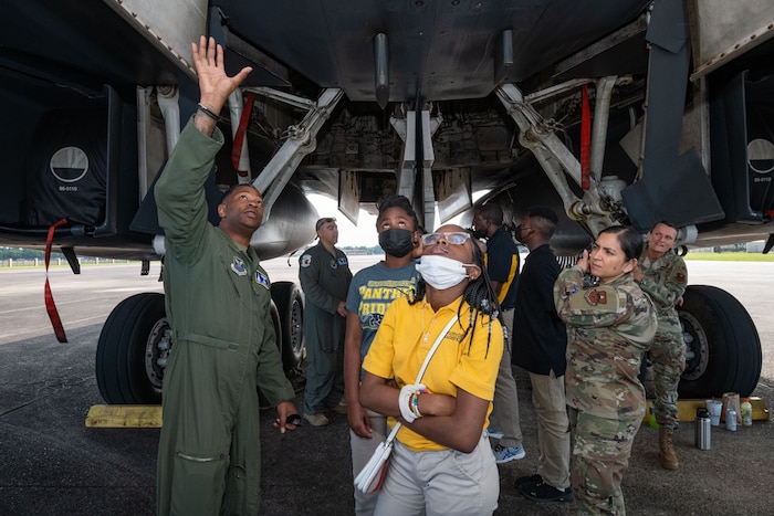 Lieutenant Colonel Brian Milner speaks to Floyd Middle School students about the B-1B Lancer from Dyess Air Force Base, May 12, 2022. The Air Force Global Strike Command B-1 bomber was at Maxwell for a Project Tuskegee engagement aimed at engaging high school students who are attending STEM focused magnet schools and participating in JROTC; the program’s mission is to increase diversity in STEM and aviation related fields.