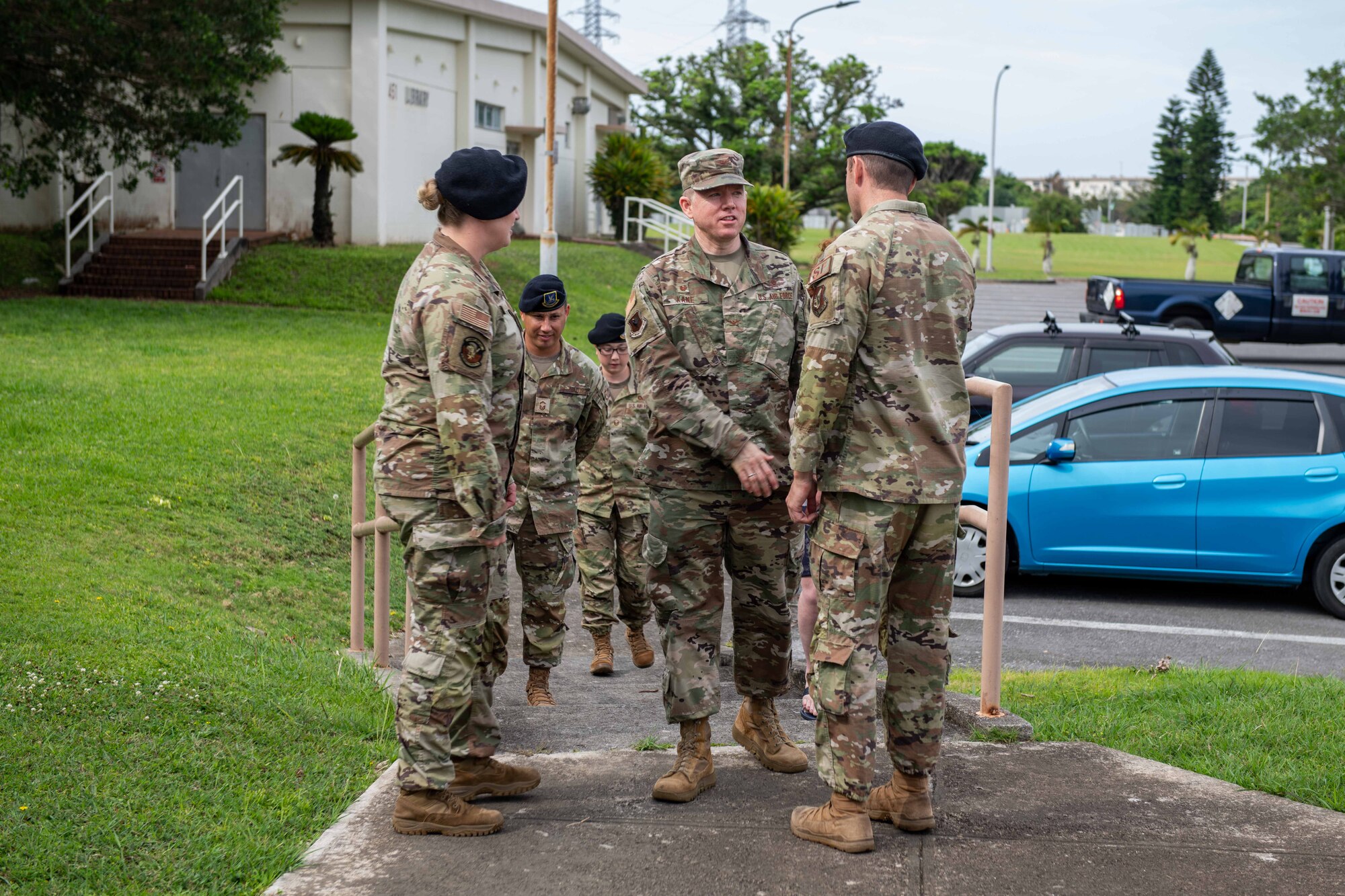 Airmen greet each other outside of a church