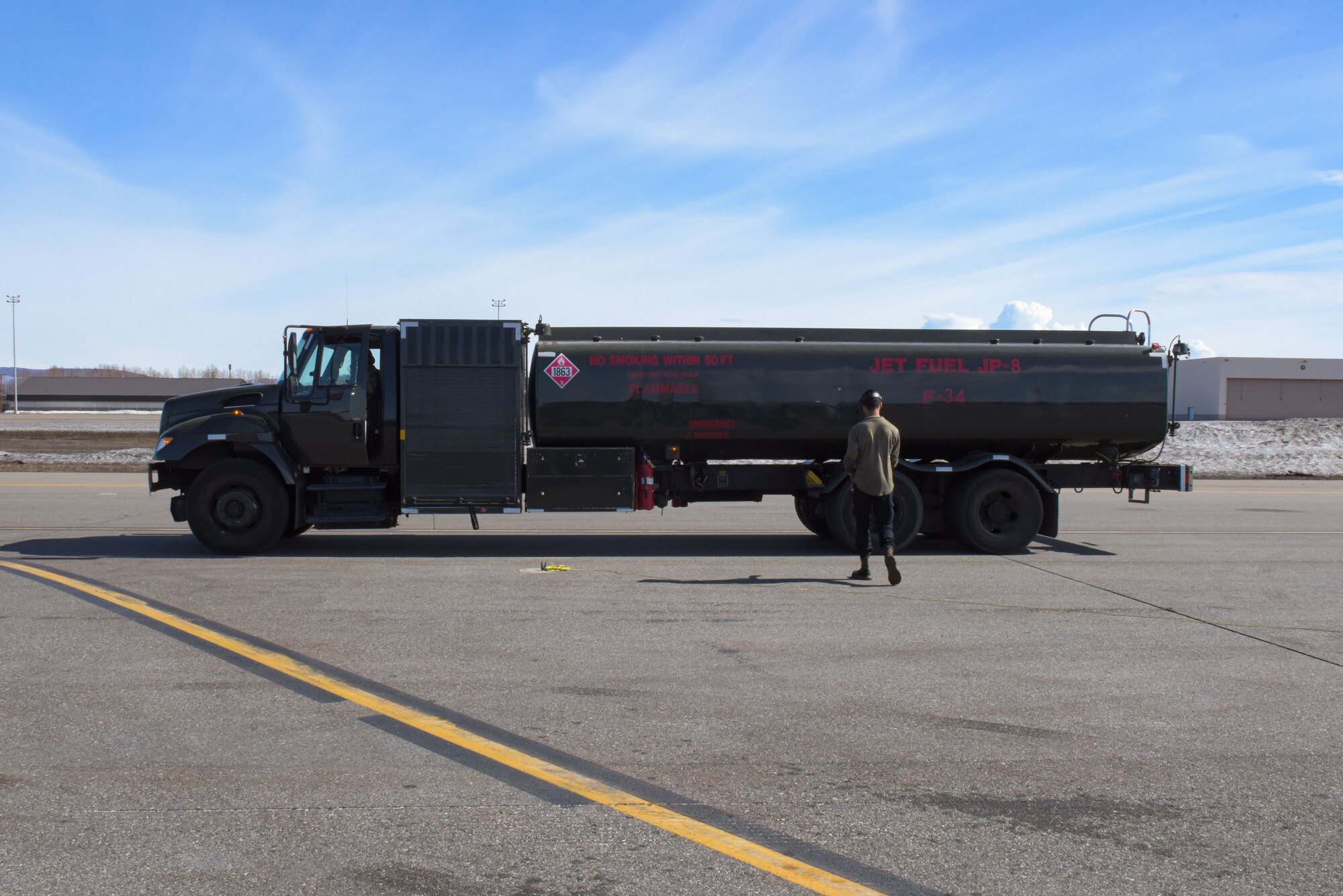 U.S. Air Force Zakeria Qasemi, 36th Aircraft Maintenance Unit crew chief, begins the refueling process for an F-16 Fighting Falcon during RED FLAG-Alaska 22-1 at Eielson Air Force Base, May 4, 2022.