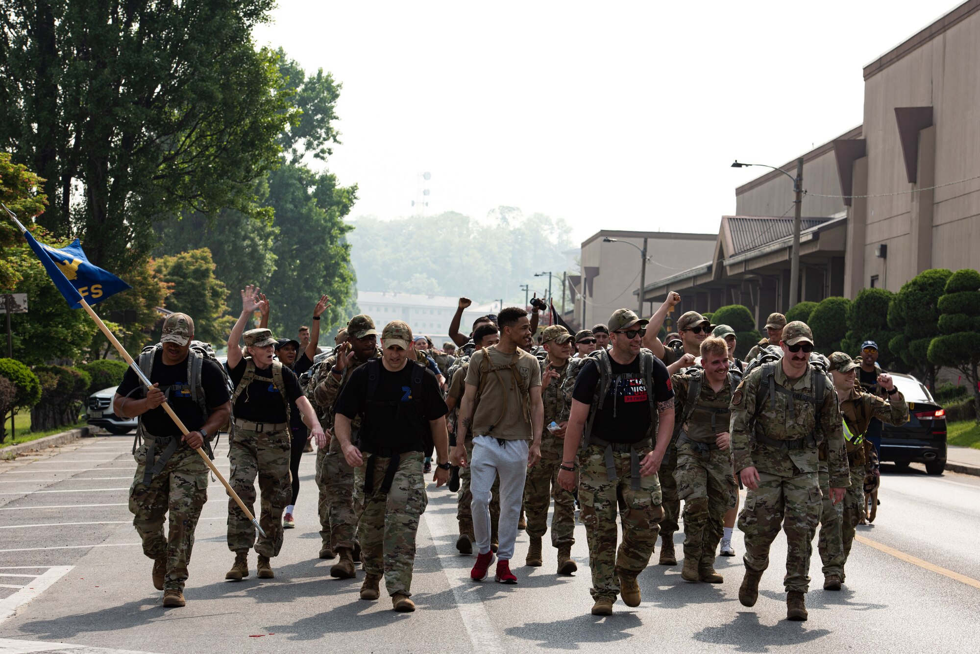 51st Security Forces Squadron members cheer on participants during a ruck march at Osan Air Base, Republic of Korea, May 13, 2022.