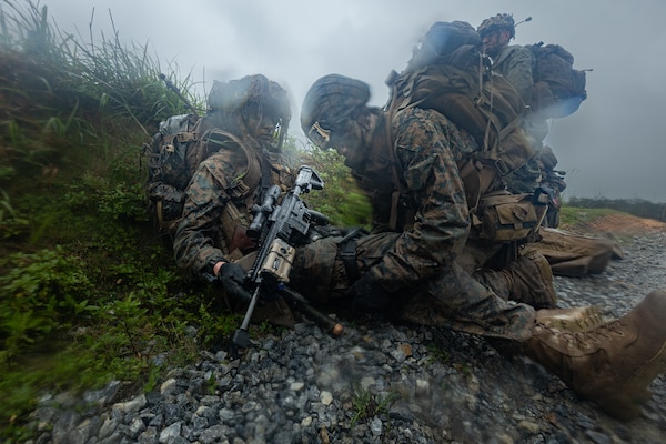 OKINAWA, Japan (May 11, 2022) A Navy corpsman assigned to 3rd Battalion, 2nd Marines, applies a tourniquet on a simulated casualty during a counter assault exercise in Okinawa, Japan, May 11, 2022. During this force-on-force exercise, an infantry company with 3/2 rapidly deployed into the double-canopy jungles of the Northern Training Area to defend against an assault from another infantry company with 1st Battalion, 3d Marines. This exercise was designed to increase 3d Marine Division’s ability to seize and defend key maritime terrain, such as islands or coastal areas, and conduct Expeditionary Advanced Base Operations in the western Pacific. 3/2 is deployed under 4th Marines, 3d Marine Division as part of the Unit Deployment Program. (U.S. Marine Corps photo by Sgt. Micha Pierce)