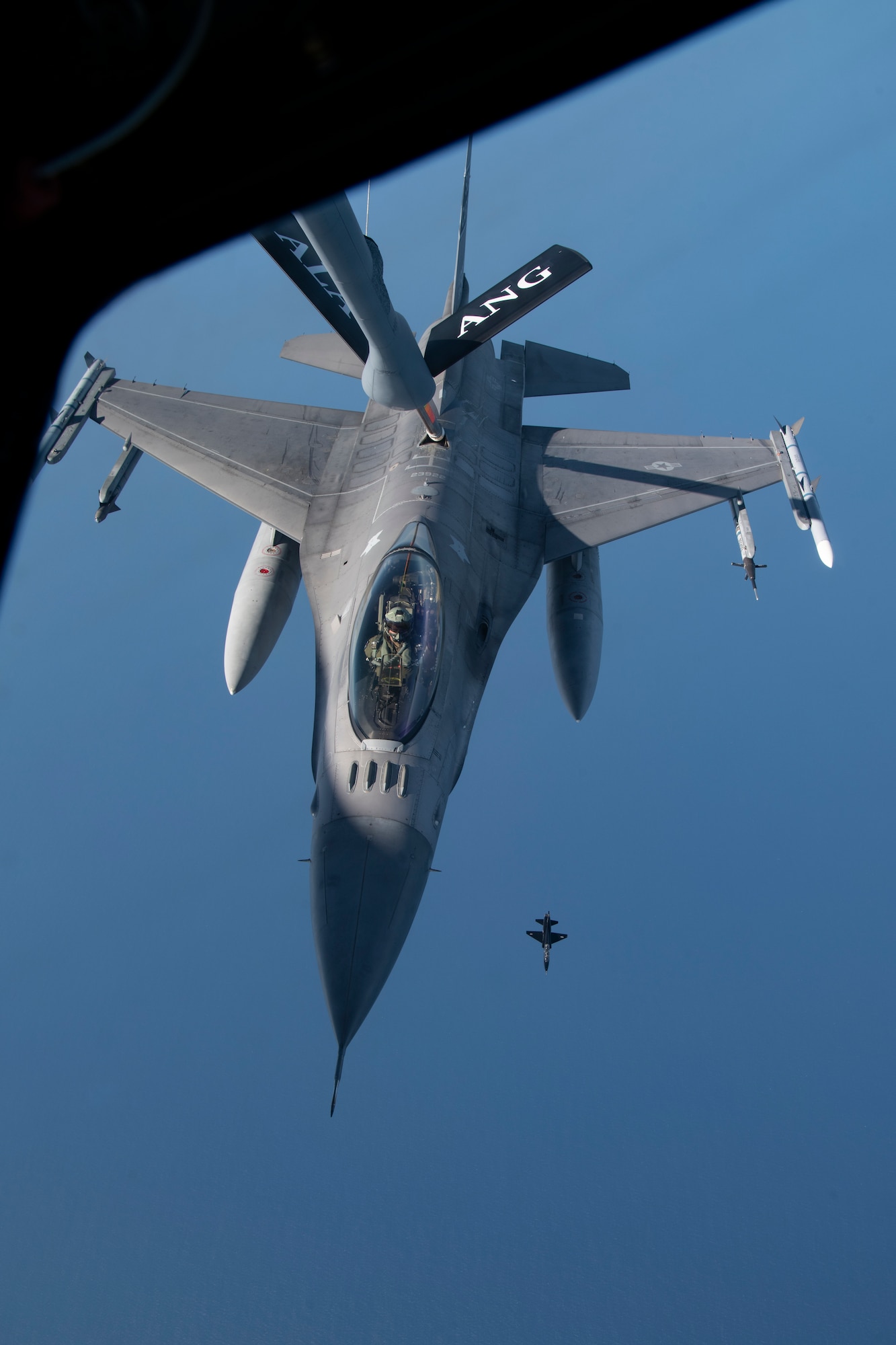 A U.S. Air Force F-16 Fighting Falcon with the 169th Fighter Wing, in-flight refuels from a KC-135 Stratotanker with the 117th Air Refueling Wing, during exercise Sentry Savannah May, 5, 2022, in a military operations area off the coast of Georgia. Sentry Savannah is a joint total force integrated exercise that showcases the nation's combat aircraft readiness, tests the capabilities of our warfighters in a near-peer environment and trains our next generation of fighter pilots for tomorrow’s fight. (U.S. Air Force photo by Staff Sgt. Hanna Smith)