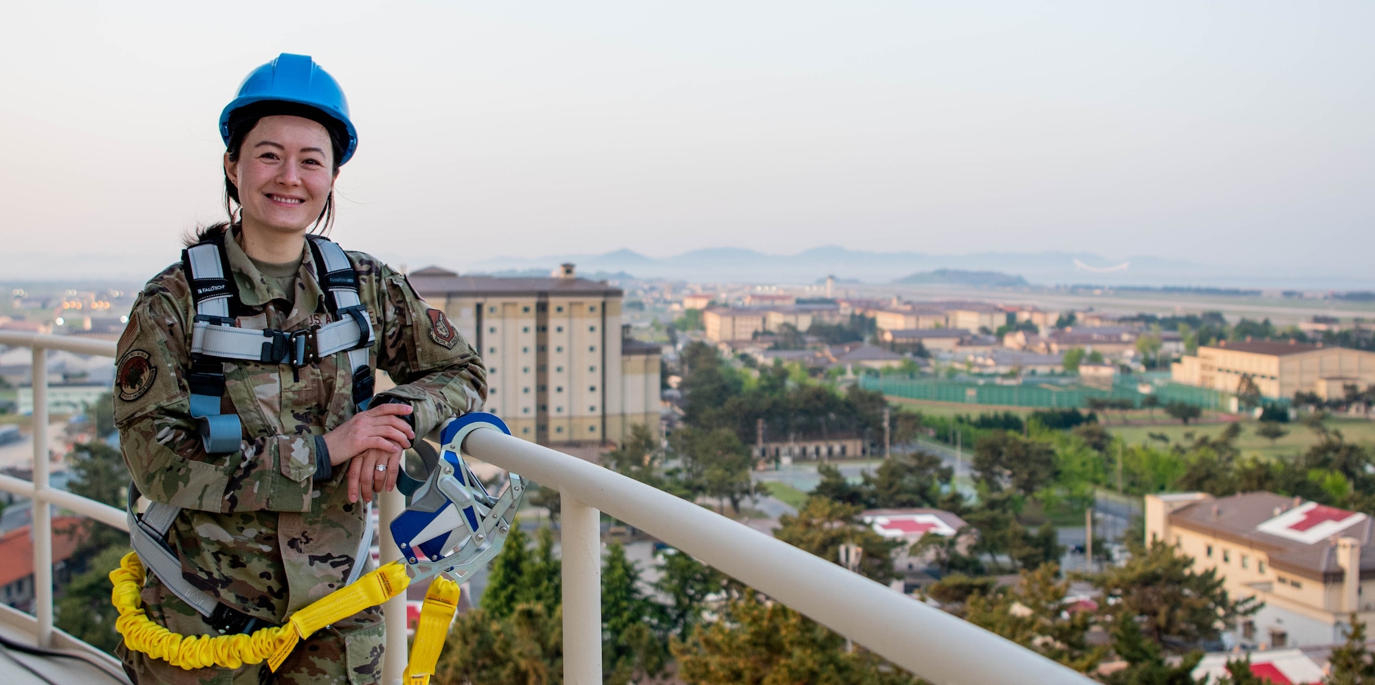 Abby Fen stands on a water tower.