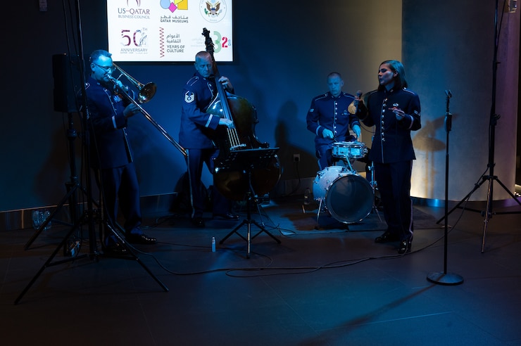 The U.S. Air Forces Central Band Poses with instruments at Al Udeid Air Base, Qatar.