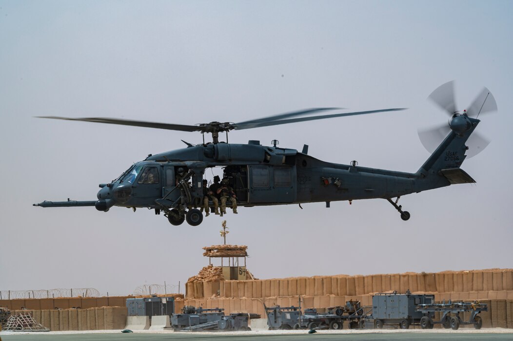 U.S. Air Force Pararescuemen, assigned to the 52nd Expeditionary Rescue Squadron, take off in an HH-60 Pave Hawk, assigned to the 46th ERQSs, for a combat search and rescue exercise at an undisclosed location, April 28, 2022. Air Forces Central Command's ERQSs are organized, trained, equipped, and postured to conduct full spectrum personnel recovery to include both conventional and unconventional combat rescue operations within the Central Command theater of operations. (U.S. Air Force photo by Staff Sgt. Christian Sullivan)