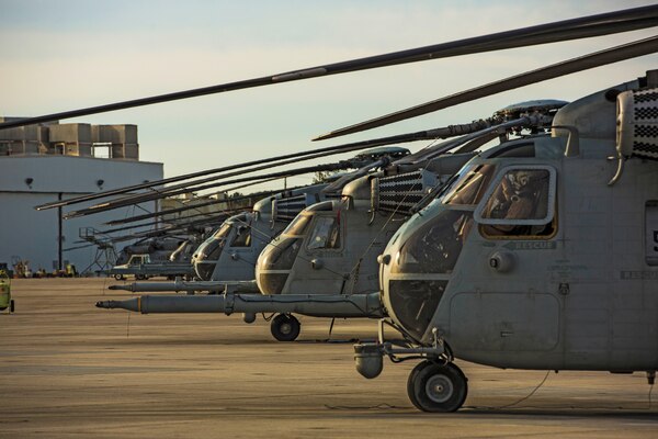 CH-53 Super Stallions are staged on a flight line at Marine Corps Air Station New River, N.C., March 12, 2015. Marine Heavy Helicopter Squadron 464 conducted Air Delivered Ground Refueling training in support of 2d Tank Battalion, 2nd Marine Division to increase unit proficiency and expand interoperability.
