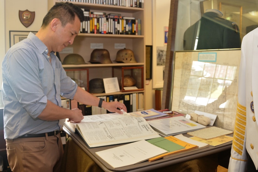 Viet Nguyen, a former Vietnamese refugee who was housed at Fort Indiantown Gap with his family for several months in 1975, views items concerning Vietnamese refugees at the Pennsylvania National Guard Military Museum on May 13, 2022, at Fort Indiantown Gap.