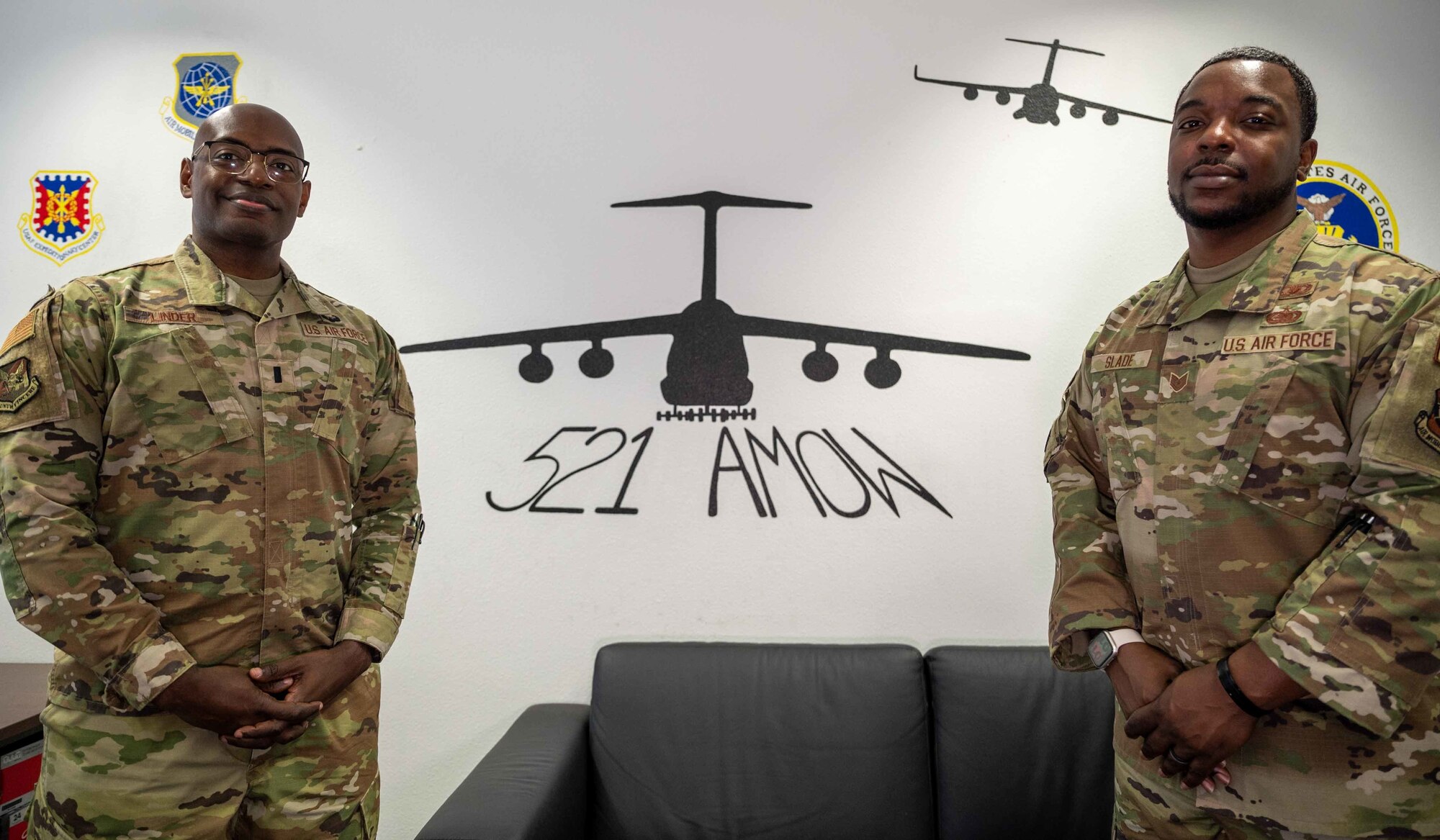 From the right, Tech. Sgt. Marcus Slade, religious affairs airman deployed to the 521st Air Mobility Operations Wing, and 1st Lt. Tarvick Linder, chaplain deployed to the 521st AMOW, pose for a photo at Ramstein Air Base, Mar. 28, 2022. Linder and Slade make up a religious support team that is assigned to the 521st AMOW to actively engage with Airmen, advise leadership, and provide spiritual care that is sensitive to the needs of all members and their families. (U.S. Air Force photo by Senior Airman Faith Schaefer)