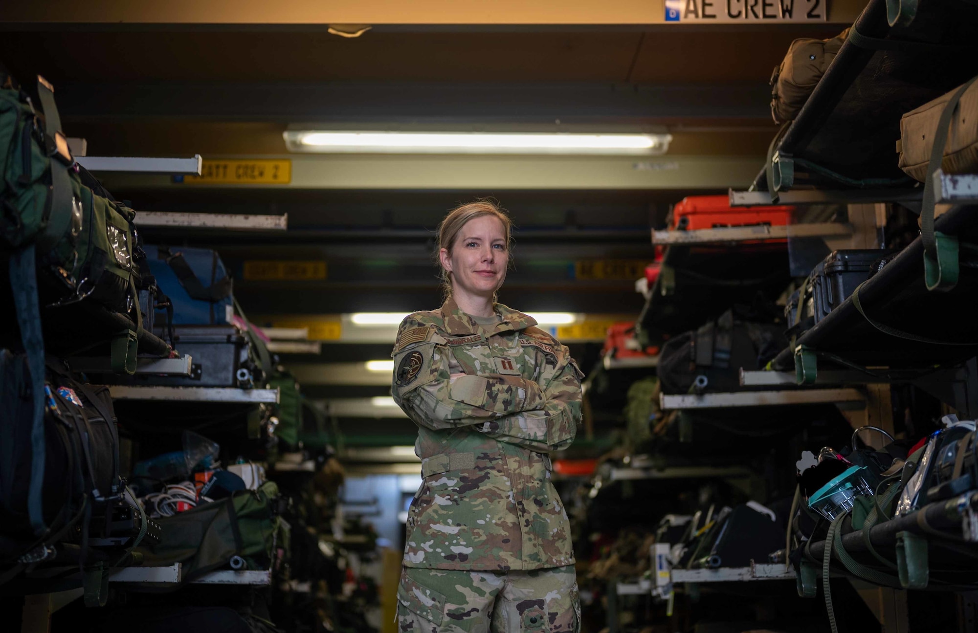 Capt. Keri Lord-Morales, 10th Expeditionary Aeromedical Evacuation Flight flight nurse, poses for a photo with medical supplies at Ramstein Air Base, Germany, Mar. 14, 2022. Lord-Morales is deployed to the 10th EAEF, attached to the 721st Mobility Support Squadron, one of ten squadrons under Air Mobility Command’s 521st Air Mobility Operations Wing. Both the squadron and wing headquarters are tenant units on Ramstein AB. (U.S. Air Force photo by Senior Airman Faith Schaefer)