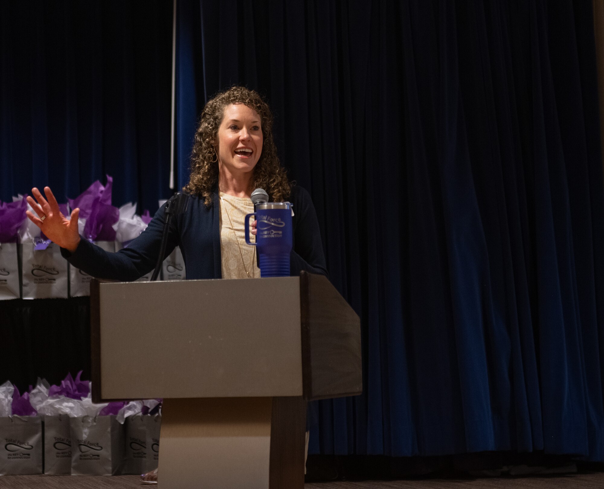 Woman speaks at podium