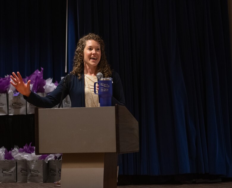 Woman speaks at podium
