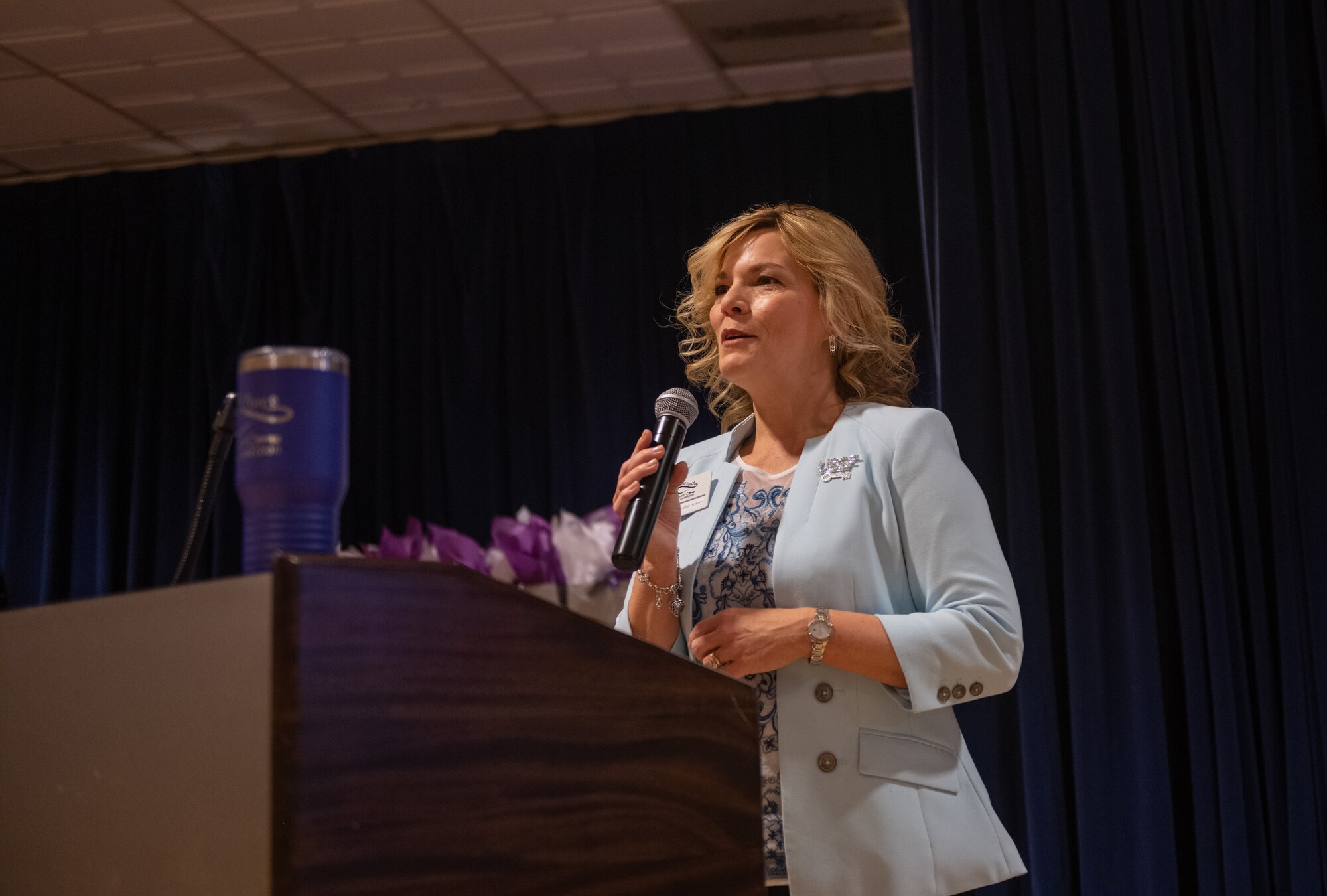 Woman speaks at podium