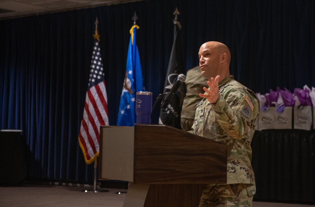 Man speaks at podium