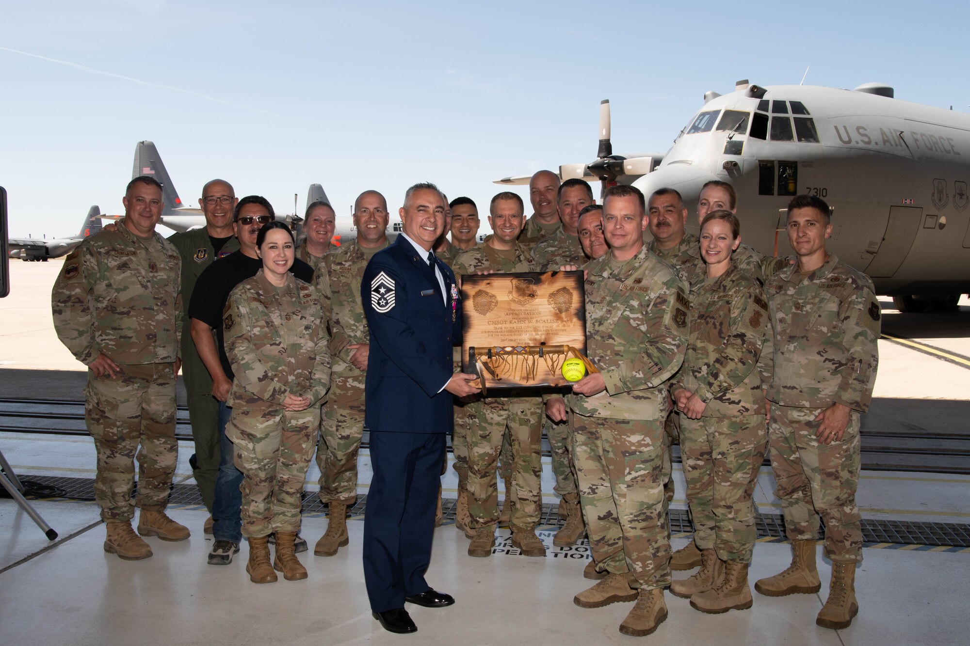 Chief Master Sgt. Kahn Scalise, 302nd Airlift Wing command chief, poses for a photo with the 302 AW Chief’s Group during his retirement ceremony