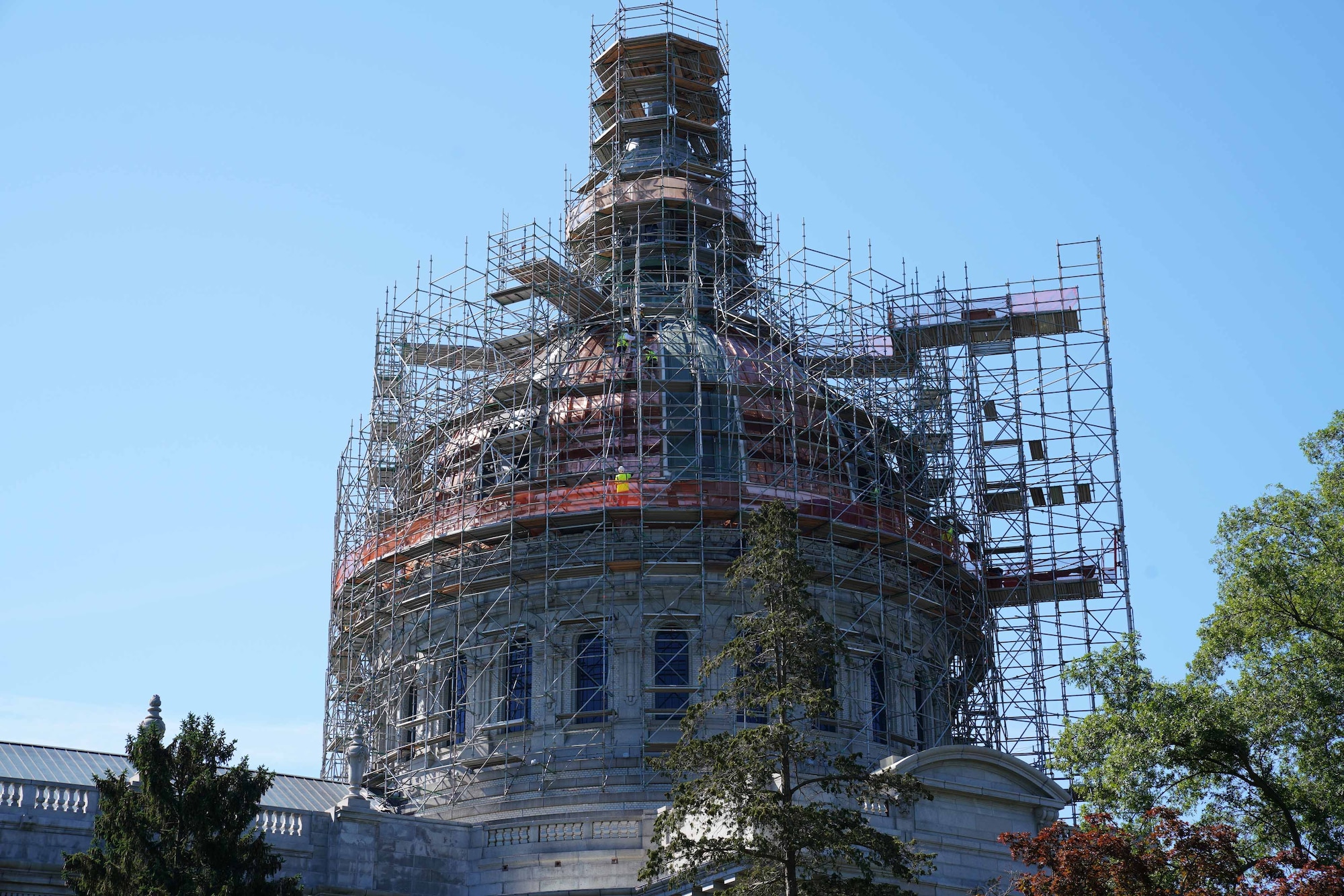 A huge chapel dome covered with scaffolding for construction.