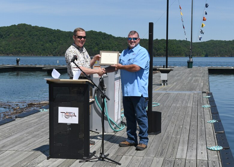 Nashville District Eastern Kentucky Operations Manager Michael Lapina awards Marina@Rowena General Manager David Dyson the Clean Marina Award for their exceptional participation in the Cumberland River Basin Clean Marina Program, at the Marina@Rowena in Albany, KY on May 17, 2022.