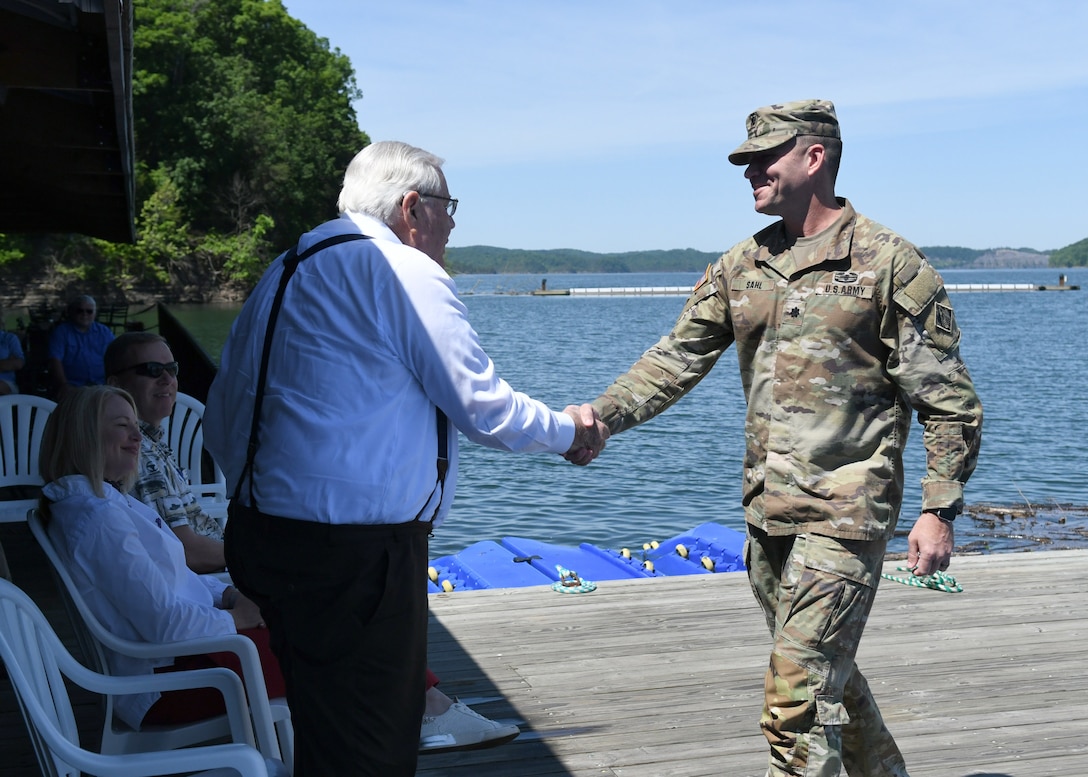 Marina@Rowena co-owner Tony Sloan shakes hands with Nashville District Commander Lt. Col. Joseph Sahl after his congratulatory speech thanking everyone at the Marina@Rowena for their collaborative efforts to keep Lake Cumberland clean and safe during the Clean Marina Award ceremony on May 17, 2022, in Albany, Ky.