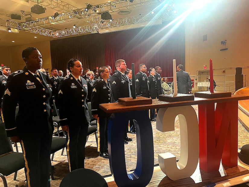 Soldiers stand at attention during an induction ceremony.