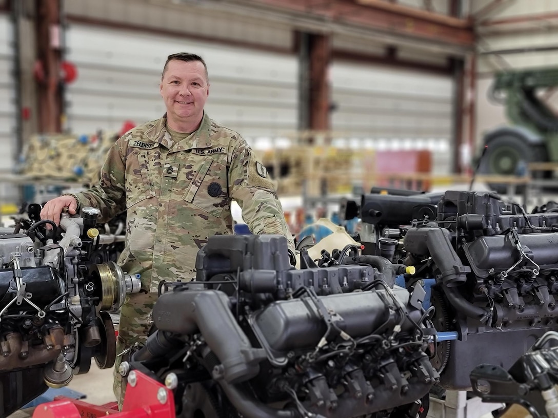 U.S. Army Sgt. 1st Class Sergey Zelenskiy, a senior instructor with the 177th Regiment, Regional Training Institute, Michigan Army National Guard, poses for a photo at Fort Custer Training Center, Augusta, Michigan, May 10, 2022. Zelenskiy an emigrant from Kyiv, Ukraine, joined the Michigan Army National Guard in 2007 and as a senior instructor, teaches Advanced Leadership Course, Wheeled Vehicle Mechanic Course, Rough Terrain Container Handler, and Combat Recovery for Wheeled Vehicles. (U.S. Air National Guard photo by Master Sgt. David Eichaker)