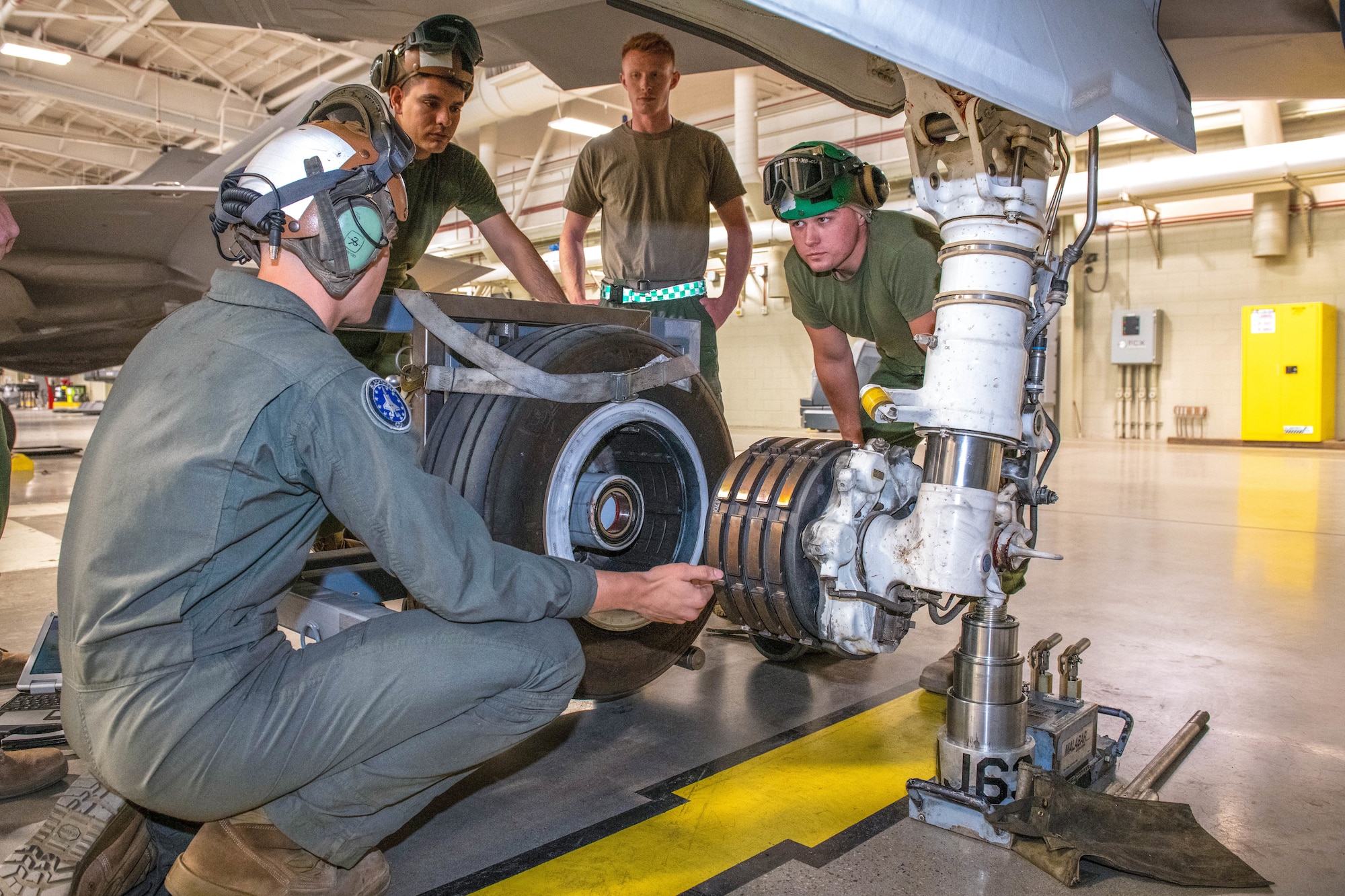 U.S. Marine Corps service members learn procedures for changing tires and inspecting brakes on the F-35A Lightning II aircraft May 9, 2022, at Luke Air Force Base, Arizona.