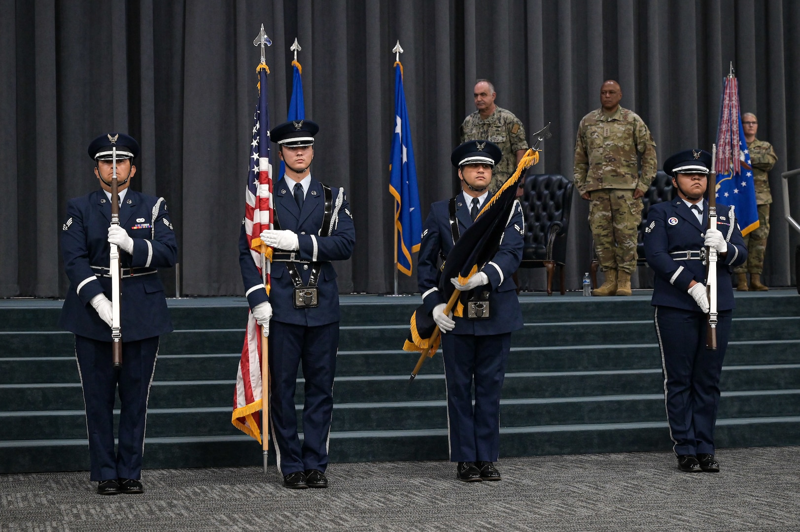 Barksdale Air Force Base Honor Guard presents the United States Flag and the U.S. Strategic Command flag during the presentation of the Joint Meritorious Unit Award that was given to AFGSC in recognition of the command’s efforts and achievements during the height of the COVID-19 pandemic. AFGSC shaped key national security policies and provided warfighting solutions across the spectrum of global operations. (U.S. Air Force photo by Senior Airman Jonathan E. Ramos)