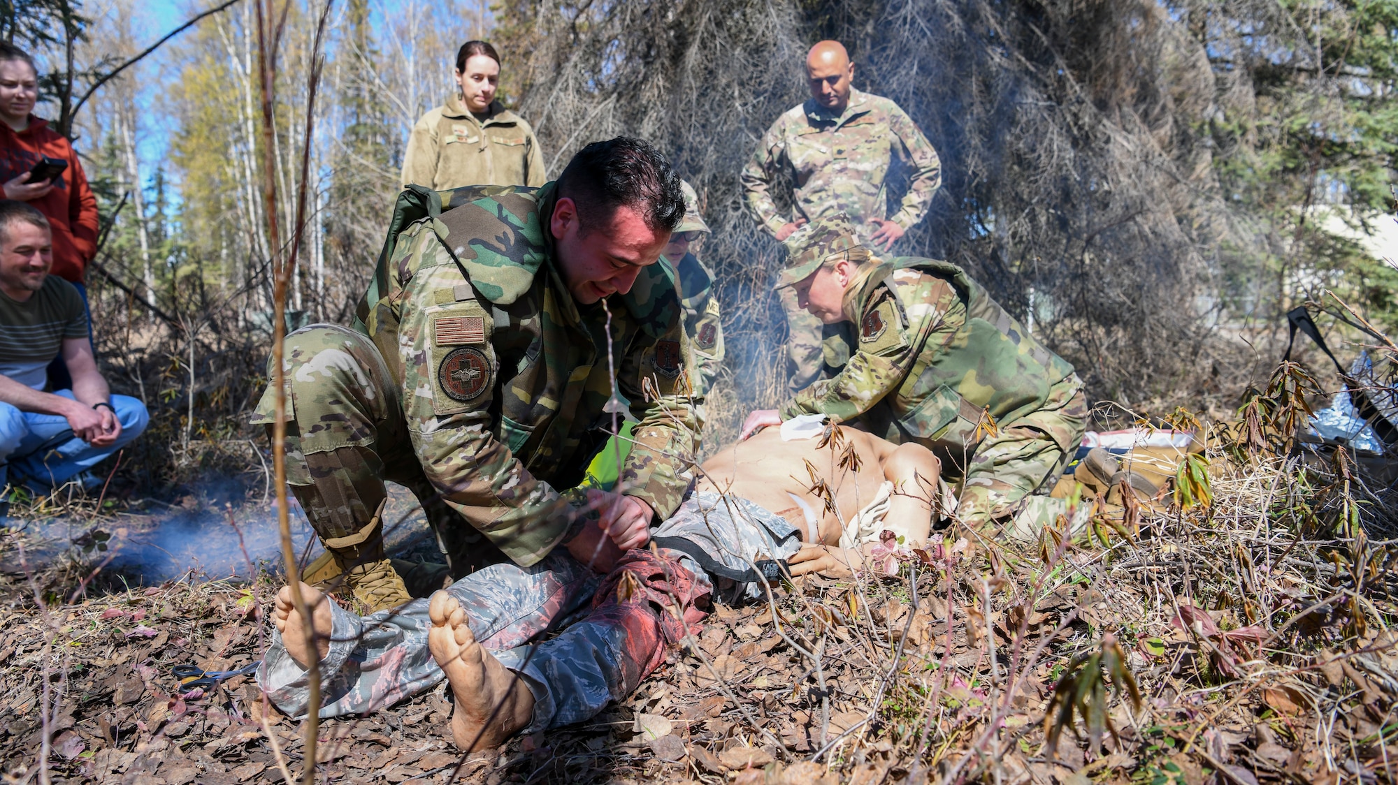 N.Y. Air National Guard airmen from the 106th Rescue Wing, Westhampton Beach, N.Y., treat a “patient,” an advanced medical simulation dummy, at Joint Base Elmendorf-Richardson in Anchorage, Alaska, May 5, 2022. The combat medics of the 106th Medical Group participated in their first Military Facility Annual Training since the start of the COVID-19 pandemic, and were expected to encounter a patient, assess the injuries, mitigate the risk, stop bleeding, treat secondary wounds, and/or resuscitate the patient and maintain the airway. (Air National Guard photo by SSgt Daniel H. Farrell)
