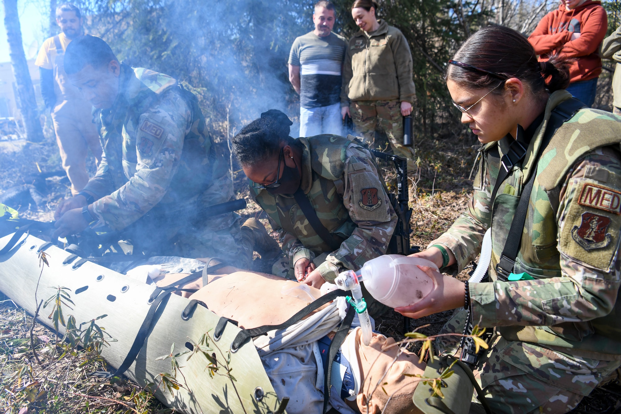 N.Y. Air National Guard airmen from the 106th Rescue Wing, Westhampton Beach, N.Y., package a “patient,” an advanced medical simulation dummy, for transport to a safe location at Joint Base Elmendorf-Richardson in Anchorage, Alaska, May 5, 2022. The combat medics of the 106th Medical Group participated in their first Military Facility Annual Training since the start of the COVID-19 pandemic, and were expected to encounter a patient, assess the injuries, mitigate the risk, stop bleeding, treat secondary wounds, and/or resuscitate the patient and maintain the airway. (Air National Guard photo by SSgt Daniel H. Farrell)