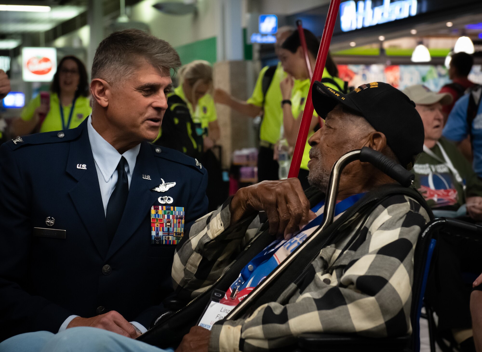 Col. Glenn Collins, 932nd Airlift Wing commander, speaks with Petty Officer 2nd Class Linzie Finley, a World War II U.S. Navy and D-Day Veteran, during an Honor Flight event in St. Louis, Mo, on May 17.