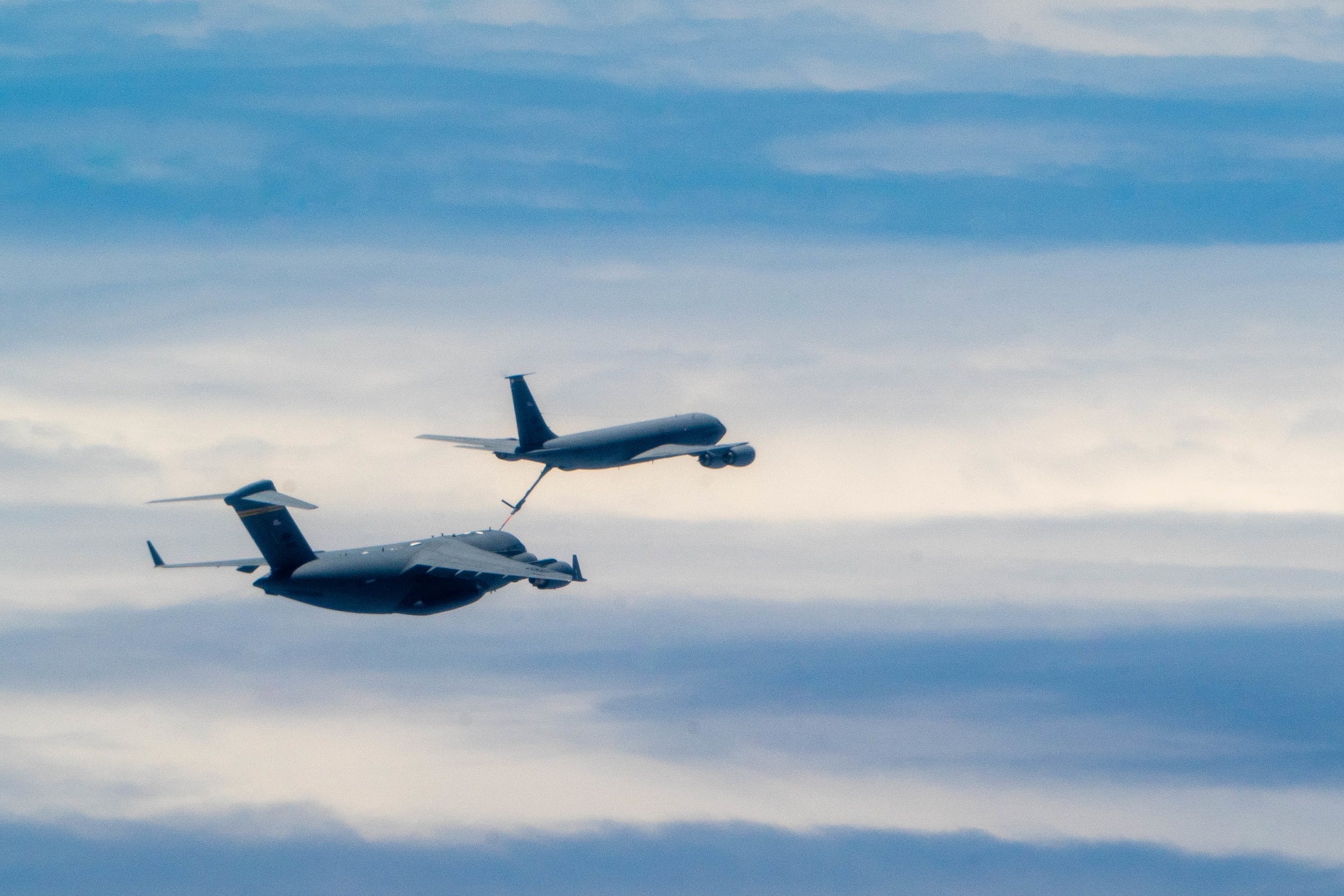 A U.S. Air Force C-17 Globemaster III gets refueled by a Hawaiian Air National Guard KC-135 during a training mission around the Hawaiian islands during Exercise Global Dexterity 2022 at Joint Base Pearl Harbor-Hickam, Hawaii, May 3, 2022. The 15th Wing invited the Royal Australian Air Force No. 36 Squadron to join in a bilateral C-17 focused exercise to better increase interoperability for future Indo-Pacific operations. (U.S. Air Force photo by Airman 1st Class Makensie Cooper)