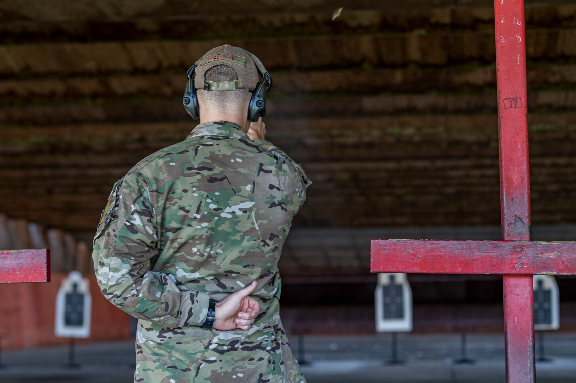 Photo of an Airman participating in an EIC pistol contest