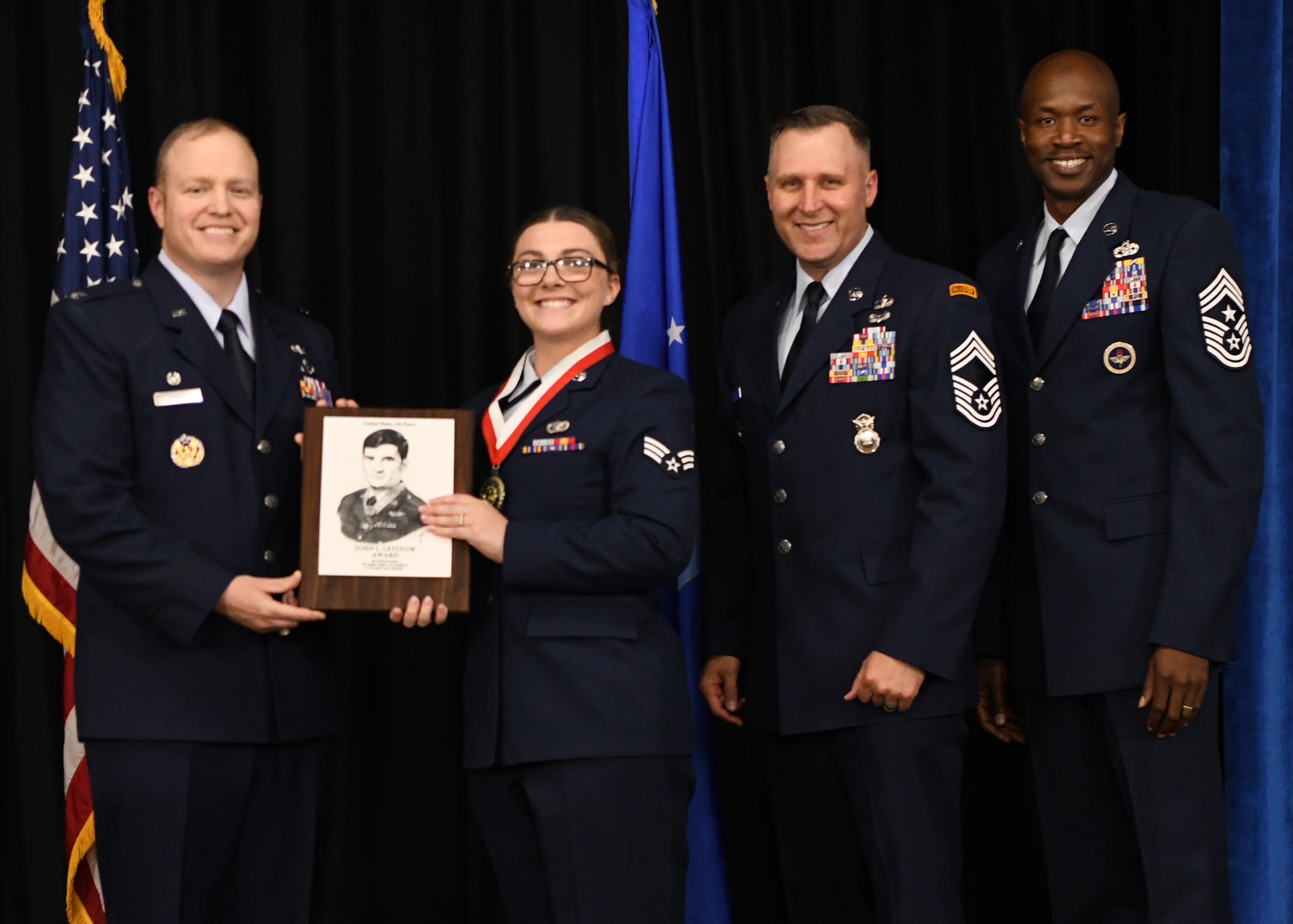 ALS graduation, receiving Levitow award