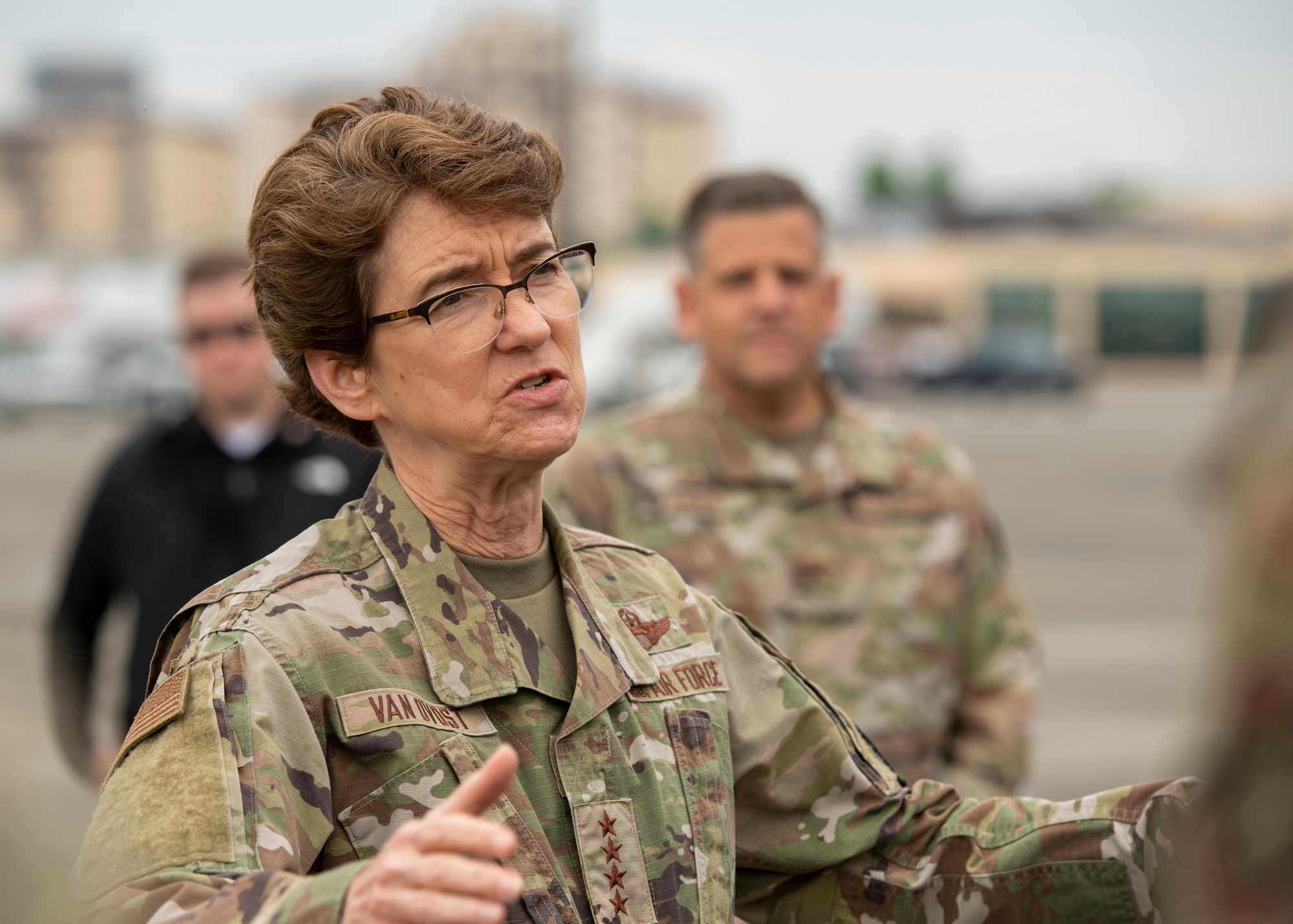 A closeup of a female general giving a speech to troops