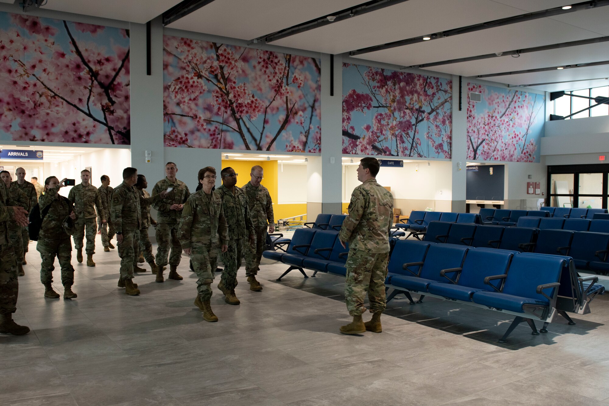 A female general is shown the new waiting area of the Yokota passenger terminal