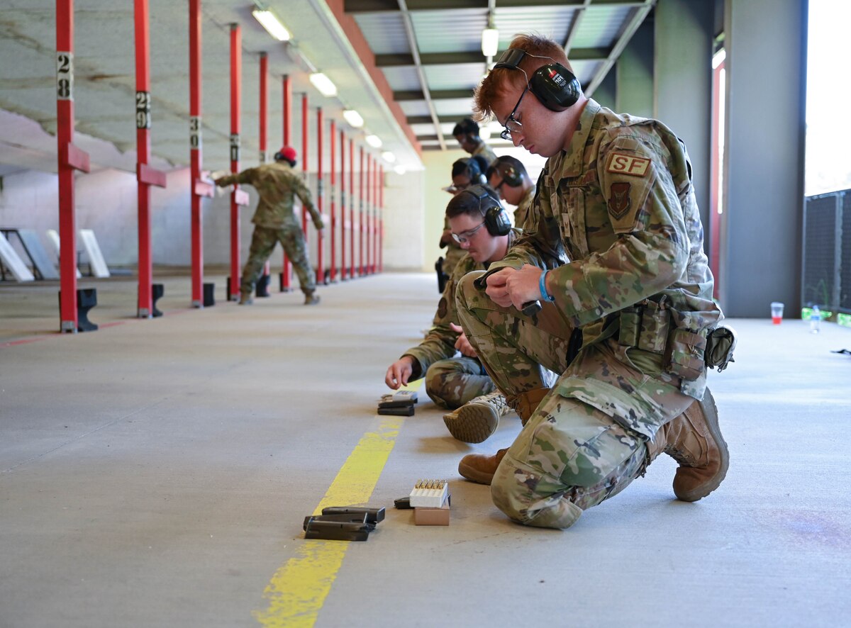 a man prepares his weapon