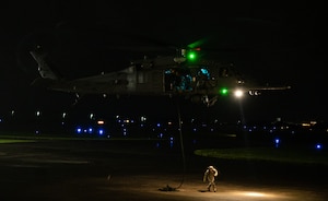 Airman departs after fast-roping from helicopter.