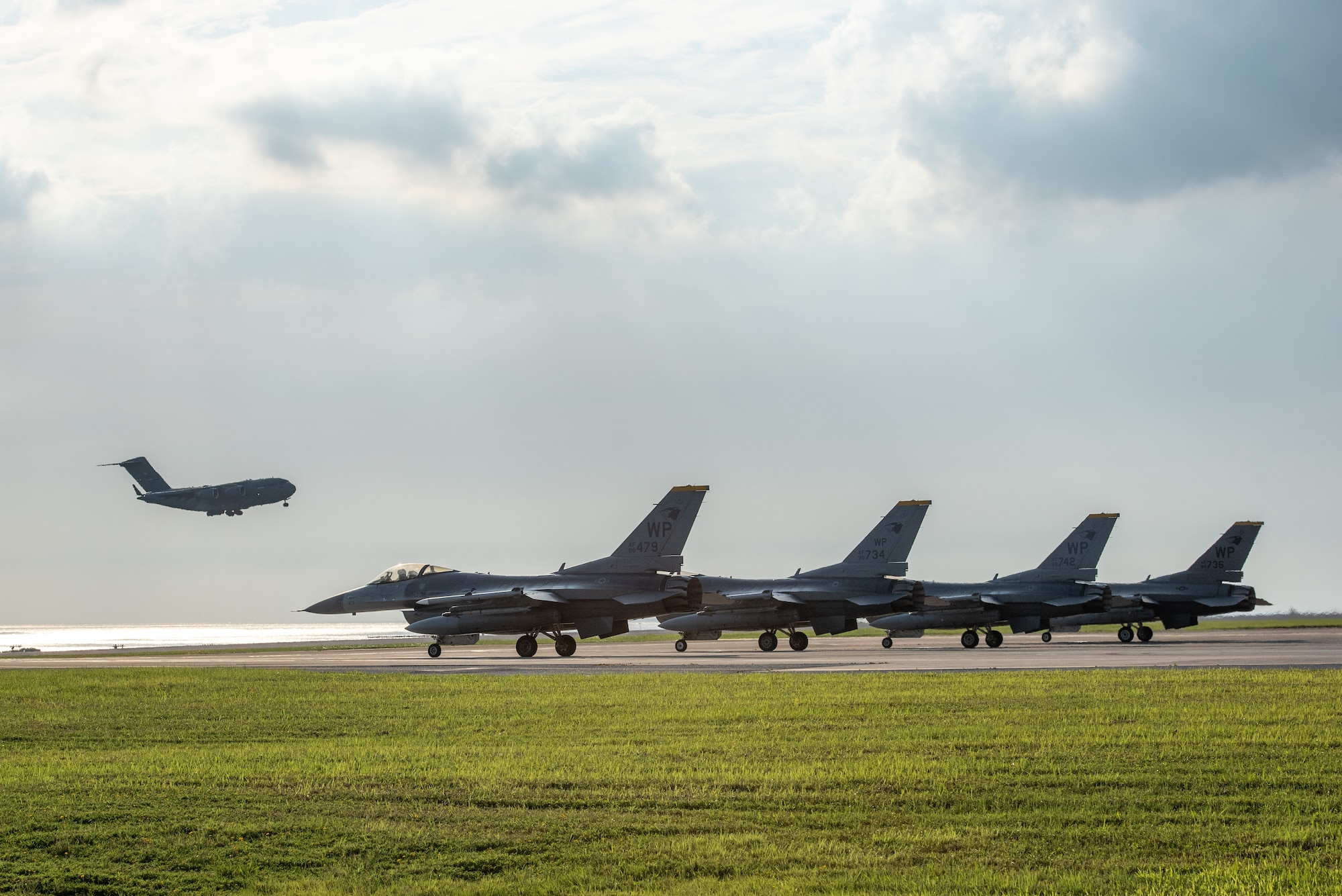 Jets parked at the end of a runway