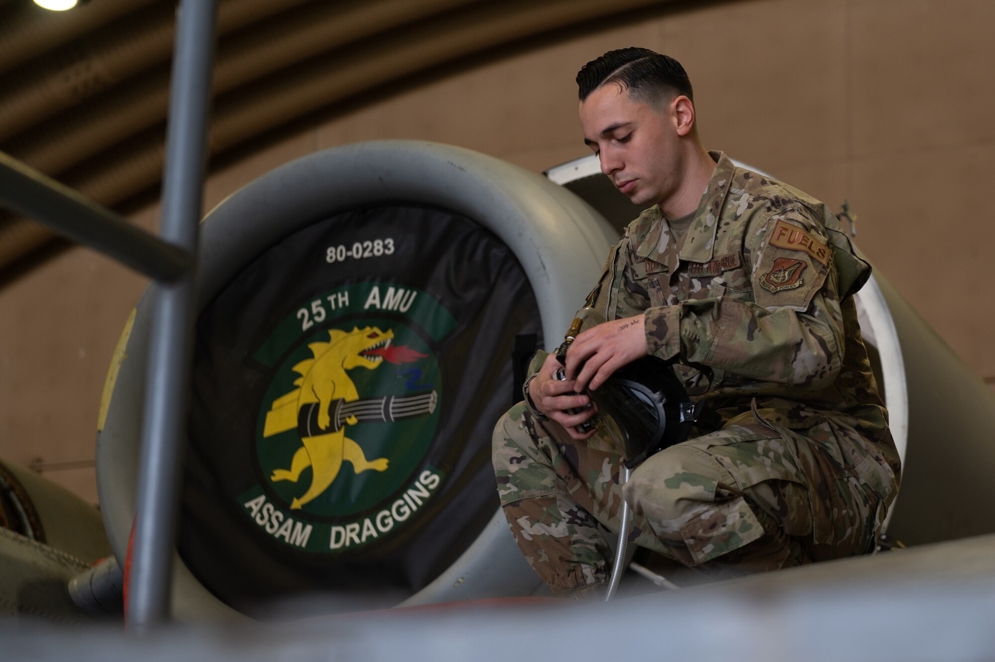 Staff Sgt. Zachery Ledo, 51st Maintenance Squadron aircraft fuels systems technician, fits a cannister onto a gas mask as part of an annual confined space training and safety event