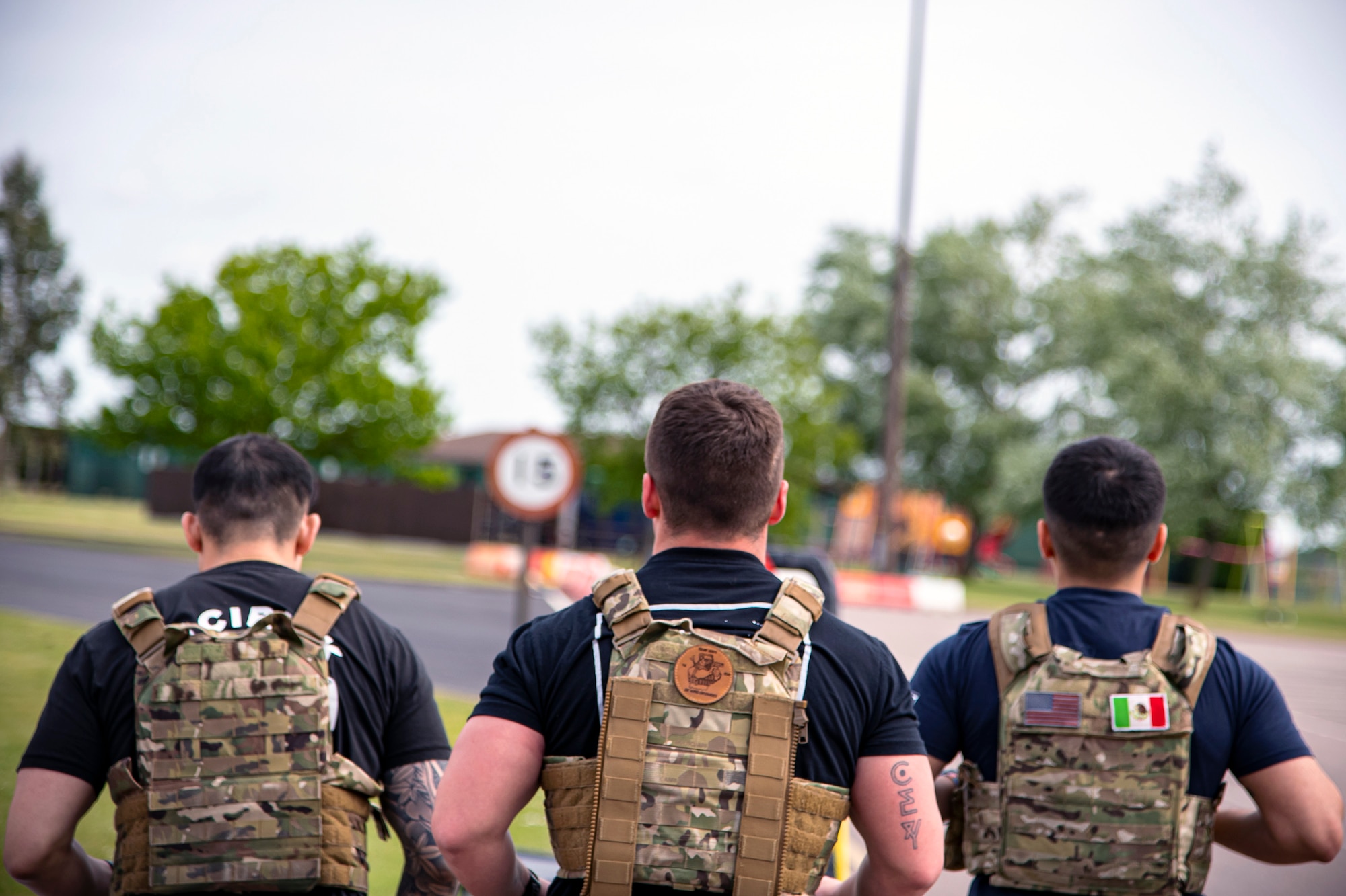 Airmen from the 423d Security Forces Squadron run during a defender challenge at RAF Alconbury, May 18, 2022. Airmen, civilians and local law enforcement participated in the challenge, held in honor of National Police Week, to pay homage to those who gave their lives in the line of duty. (U.S. Air Force photo by Staff Sgt. Eugene Oliver)
