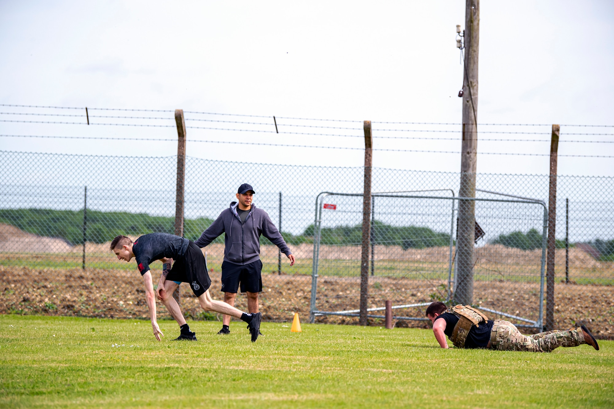 Airmen from the 423d Security Forces Squadron complete a defender challenge at RAF Alconbury, May 18, 2022. Airmen, civilians and local law enforcement participated in the challenge, held in honor of National Police Week, to pay homage to those who gave their lives in the line of duty. (U.S. Air Force photo by Staff Sgt. Eugene Oliver)