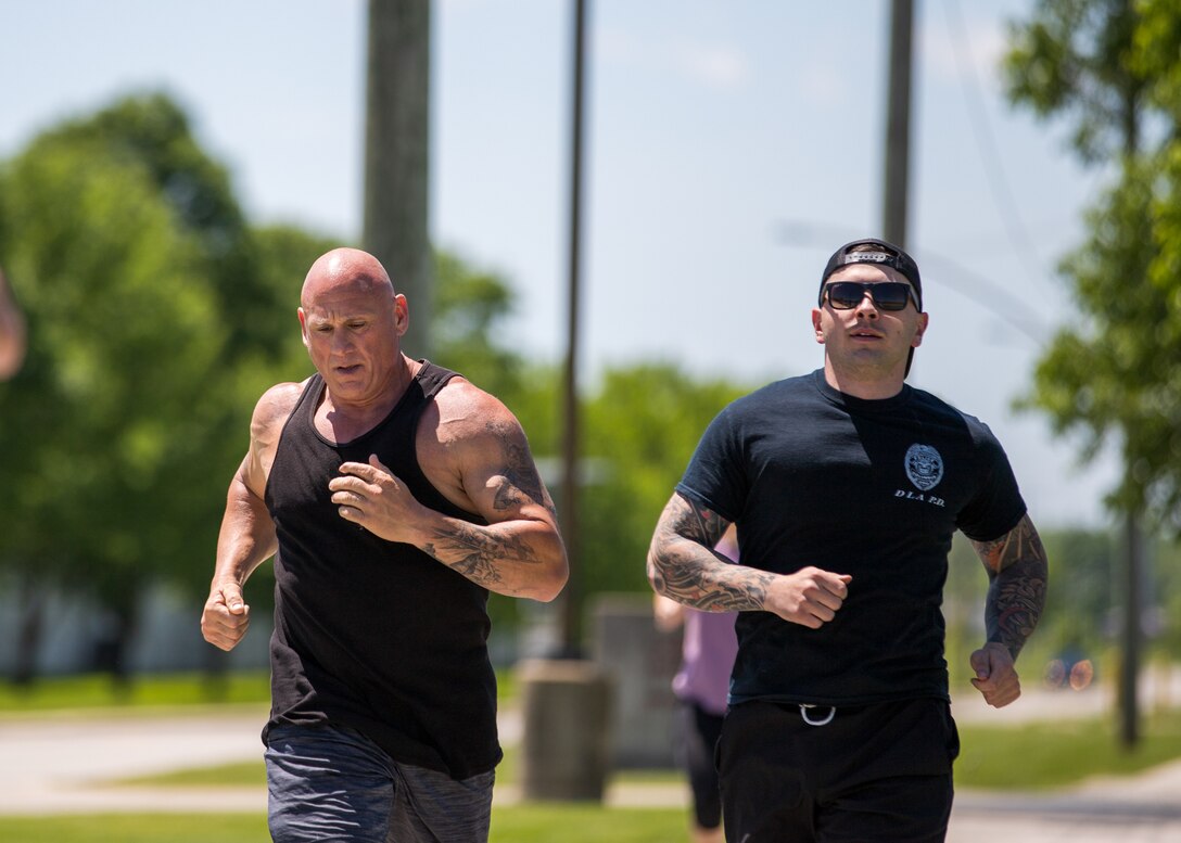 Two men running.