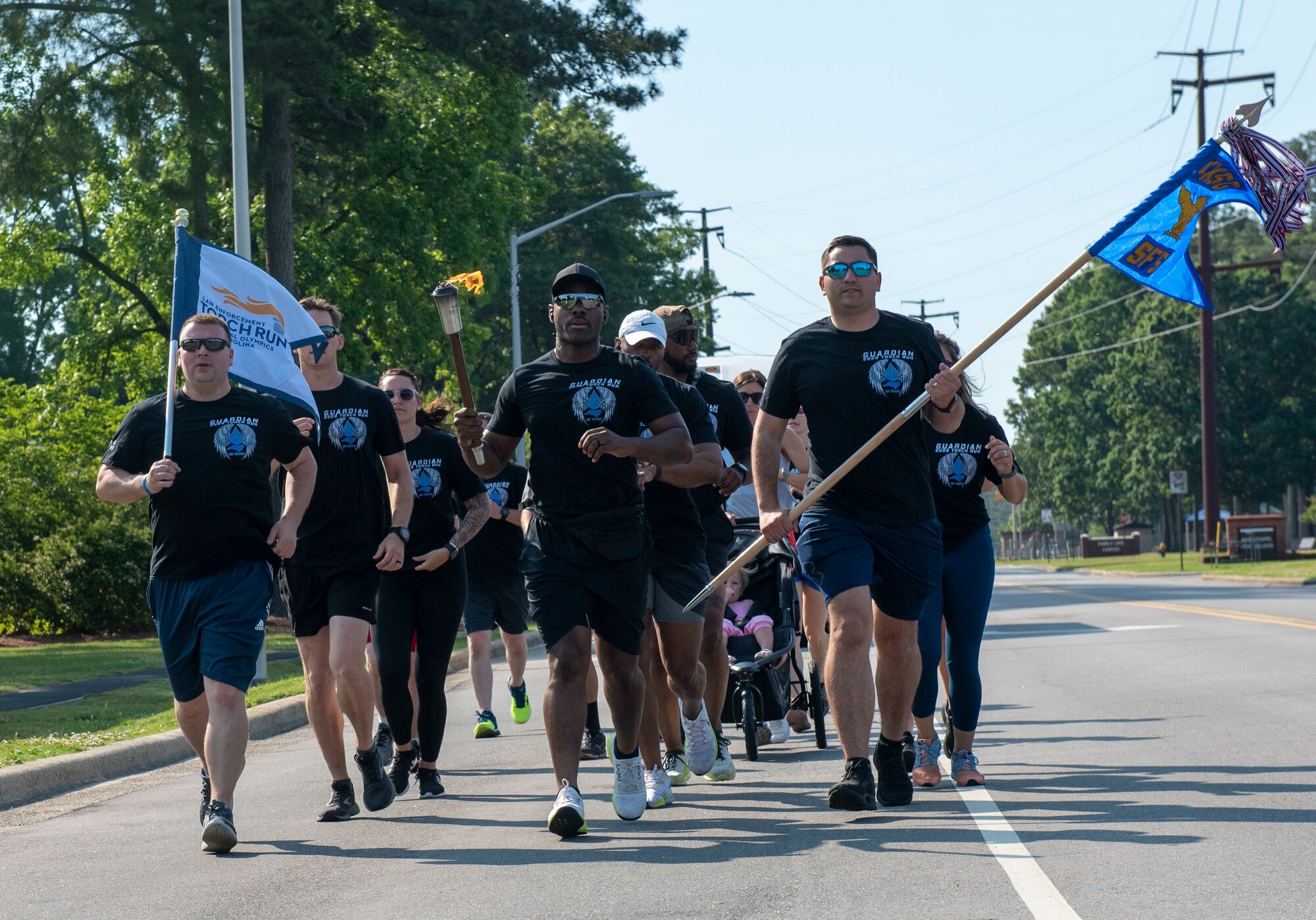 Members of the Goldsboro Police Department, Wayne County Emergency Medical Services and Wayne County Sheriff's Office march alongside base personnel during National Police Week at Seymour Johnson Air Force Base, North Carolina, May 18, 2022. National Police Week is held in commemoration of law enforcement officers who gave their lives in the line of duty. (U.S. Air Force photo by Airman 1st Class Sabrina Fuller)