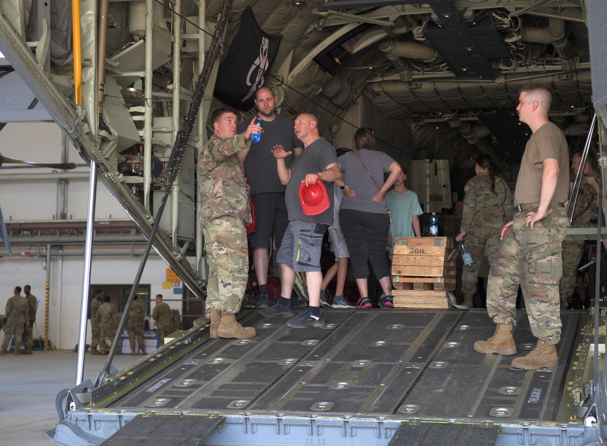 People talk in the back of a plane