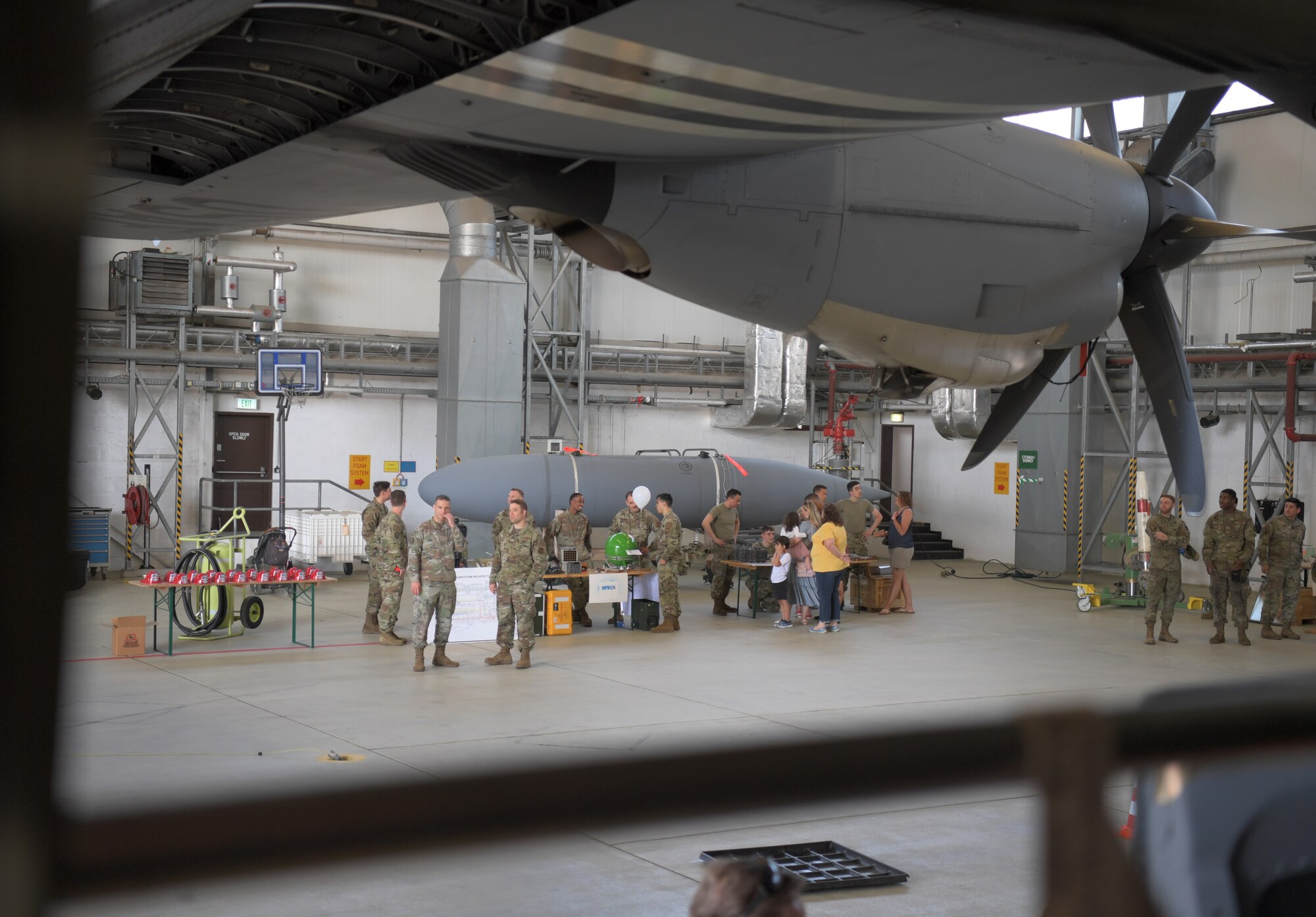 Airplane hangar with people inside