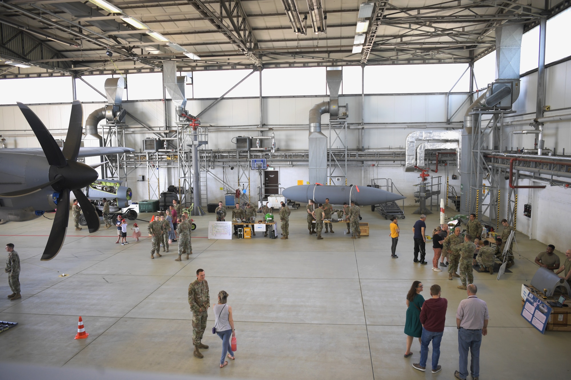 Airplane hangar with people inside