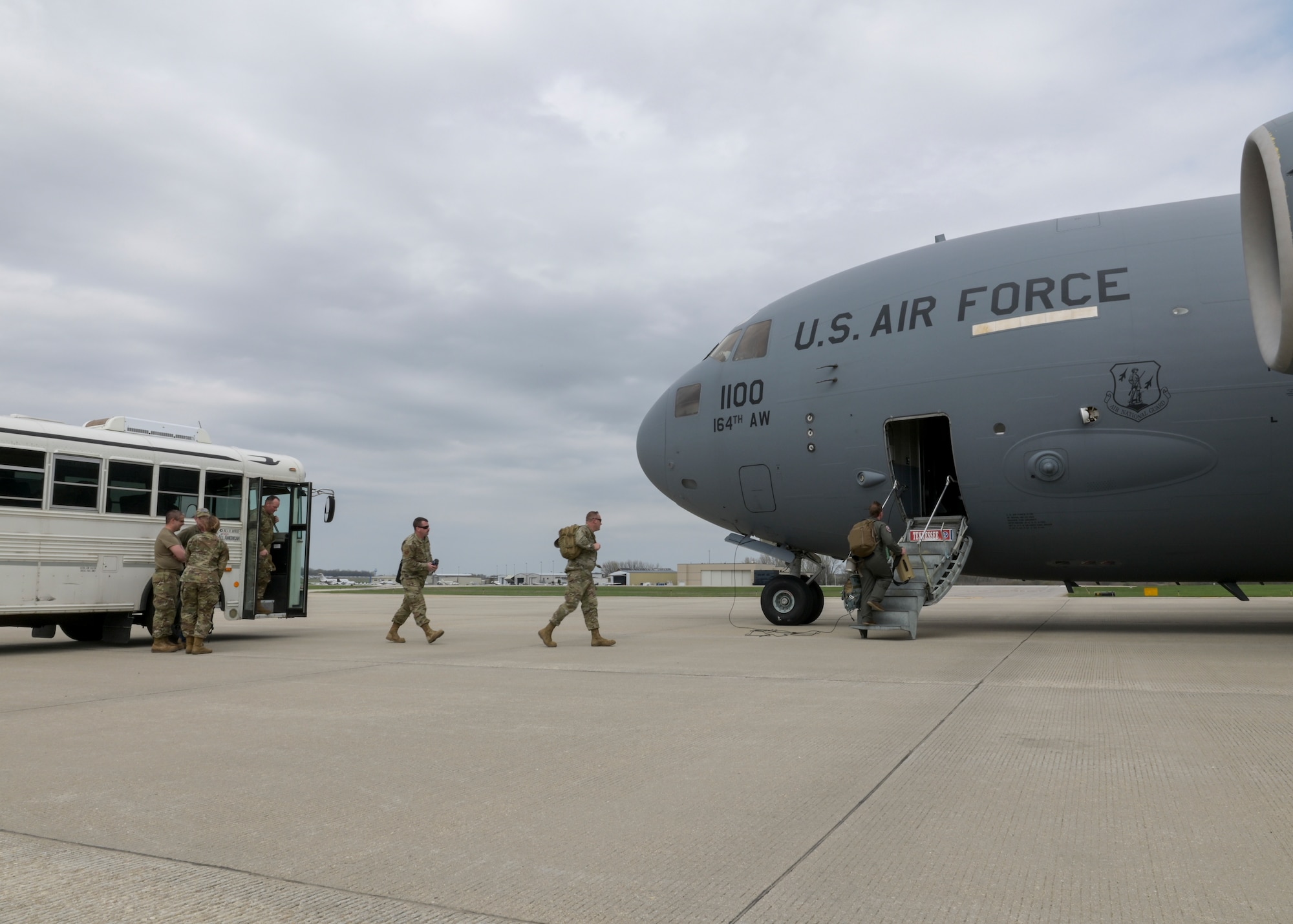 Airmen board a C-17 Globemaster III aircraft.